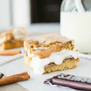 Snickerdoodles and S'mores collide in these sweet, cinnamony, and outrageously addictive cookie bars!