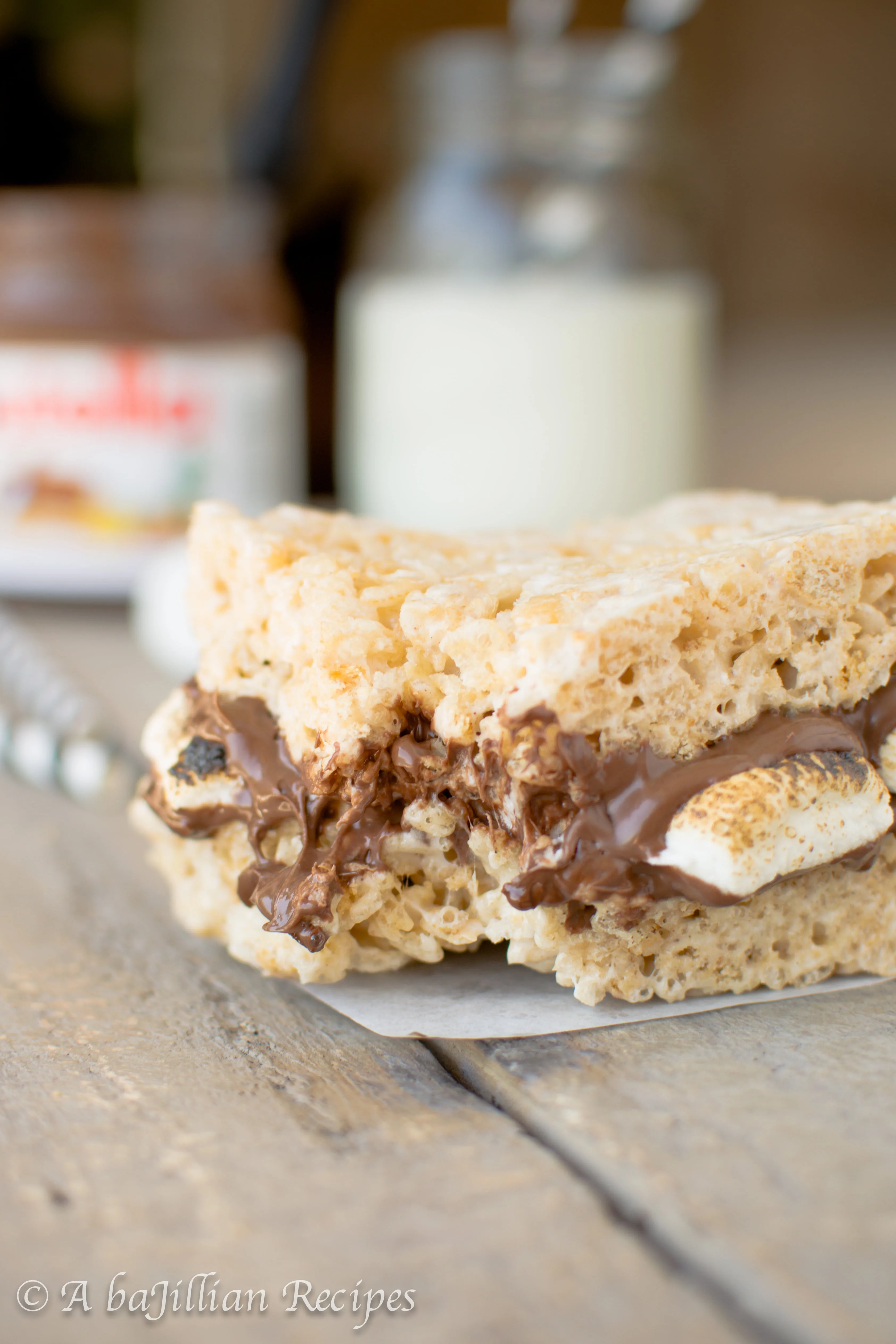 Rich, chocolatey Nutella and warm, toasty marshmallows sandwiched between brown butter rice krispies treats!