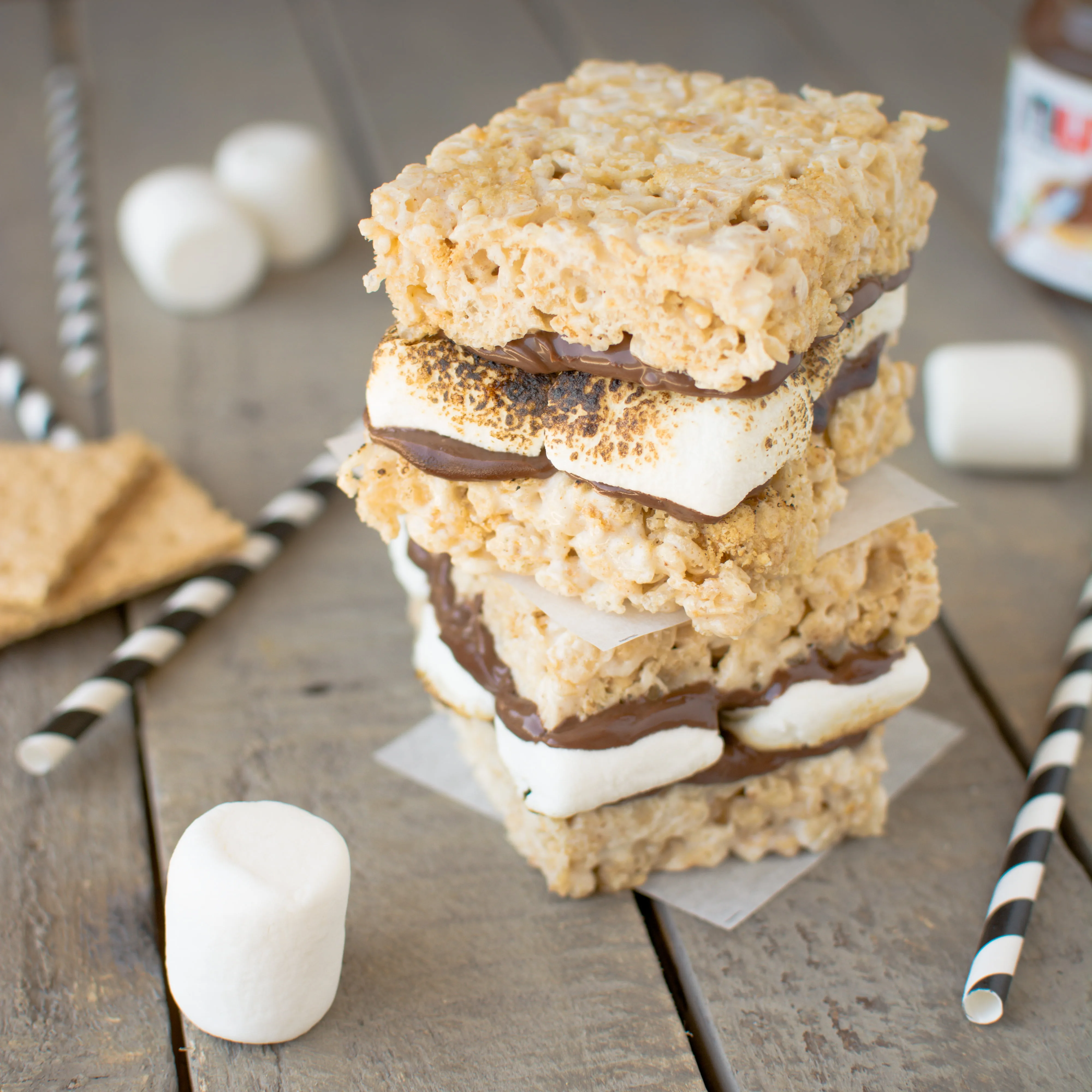 Rich, chocolatey Nutella and warm, toasty marshmallows sandwiched between brown butter rice krispies treats!