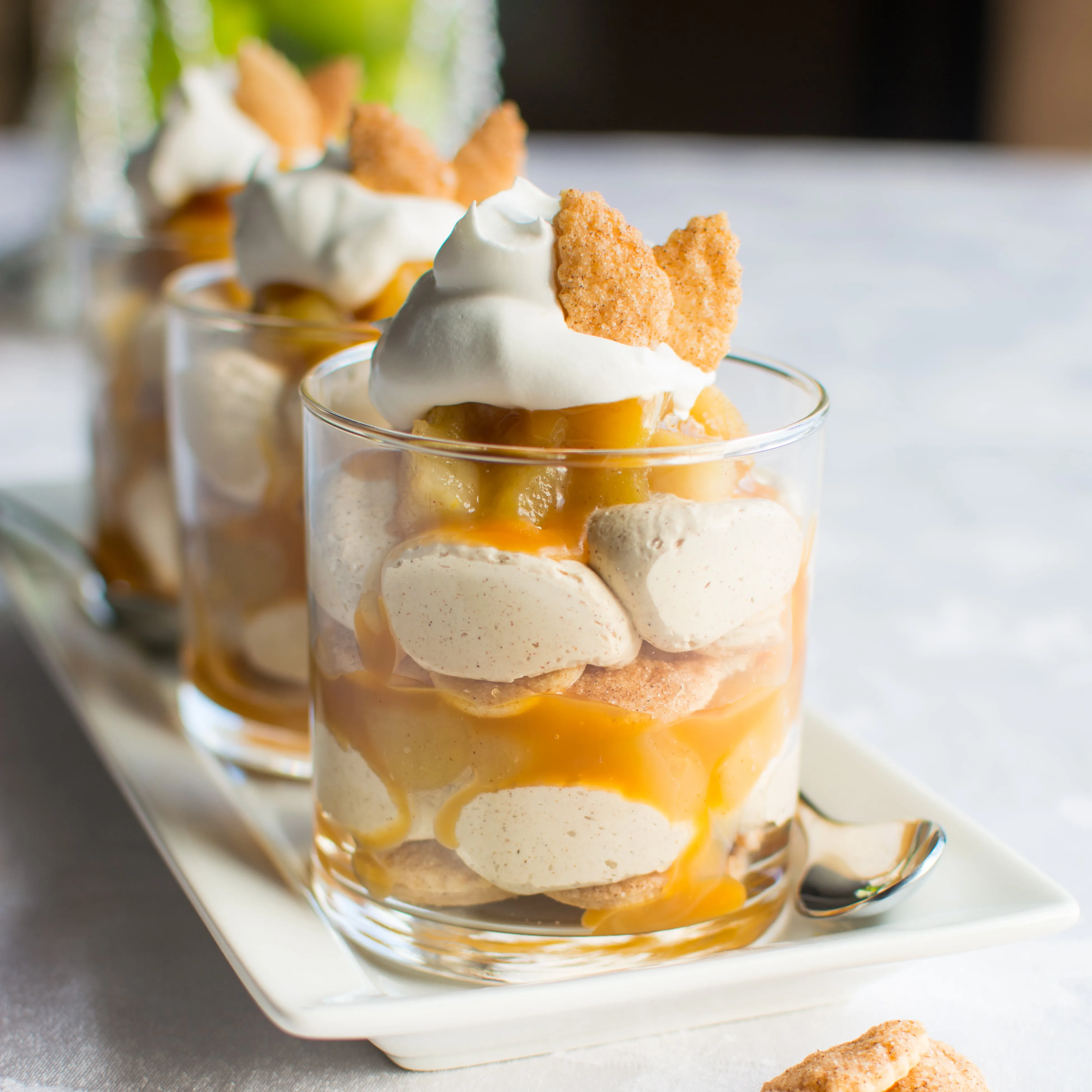 Layers of cinnamon sugar pie crust, homemade apple pie filling, rich caramel, and cinnamon-spiced cream filling--An American classic in parfait form!