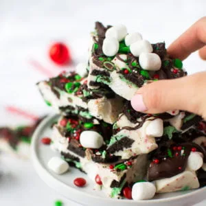 Minty Oreos, marshmallows, and M&Ms embedded in peppermint-speckled white chocolate and drizzled with dark chocolate! Don't forget the sprinkles!