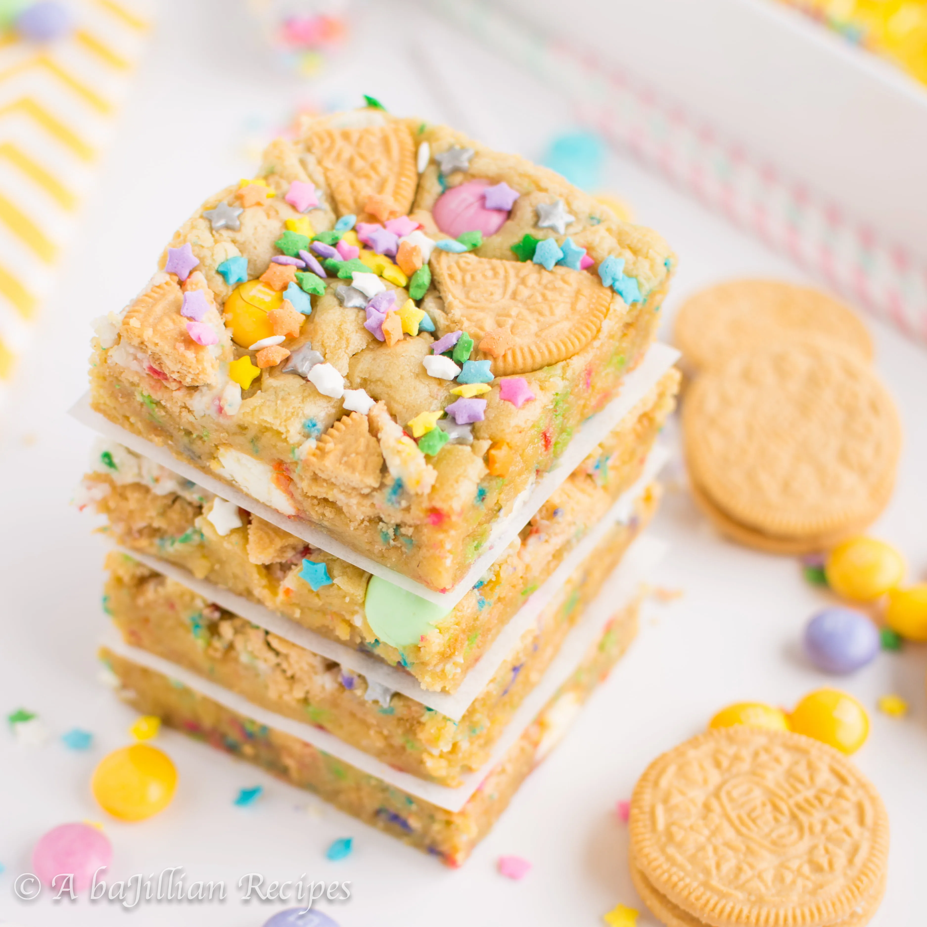 Soft-baked cake batter cookie bars loaded up with Golden Birthday Cake Oreos, Vanilla Cupcake white chocolate M&Ms, and of course, sprinkles!