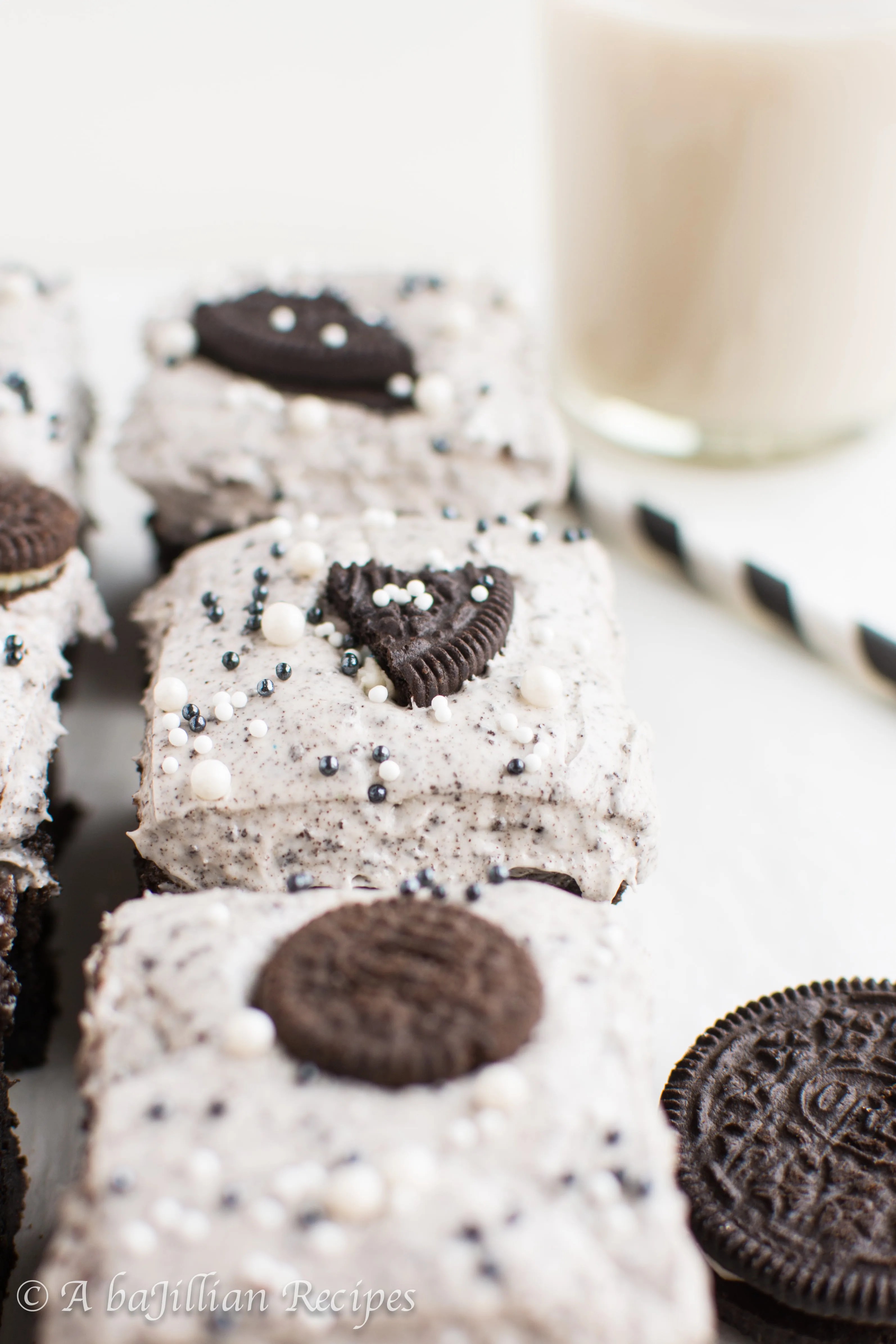 Thick and fudgy brownies, Oreo truffle filling, and fluffy Oreo frosting! THREE layers of Oreo deliciousness in one bite!