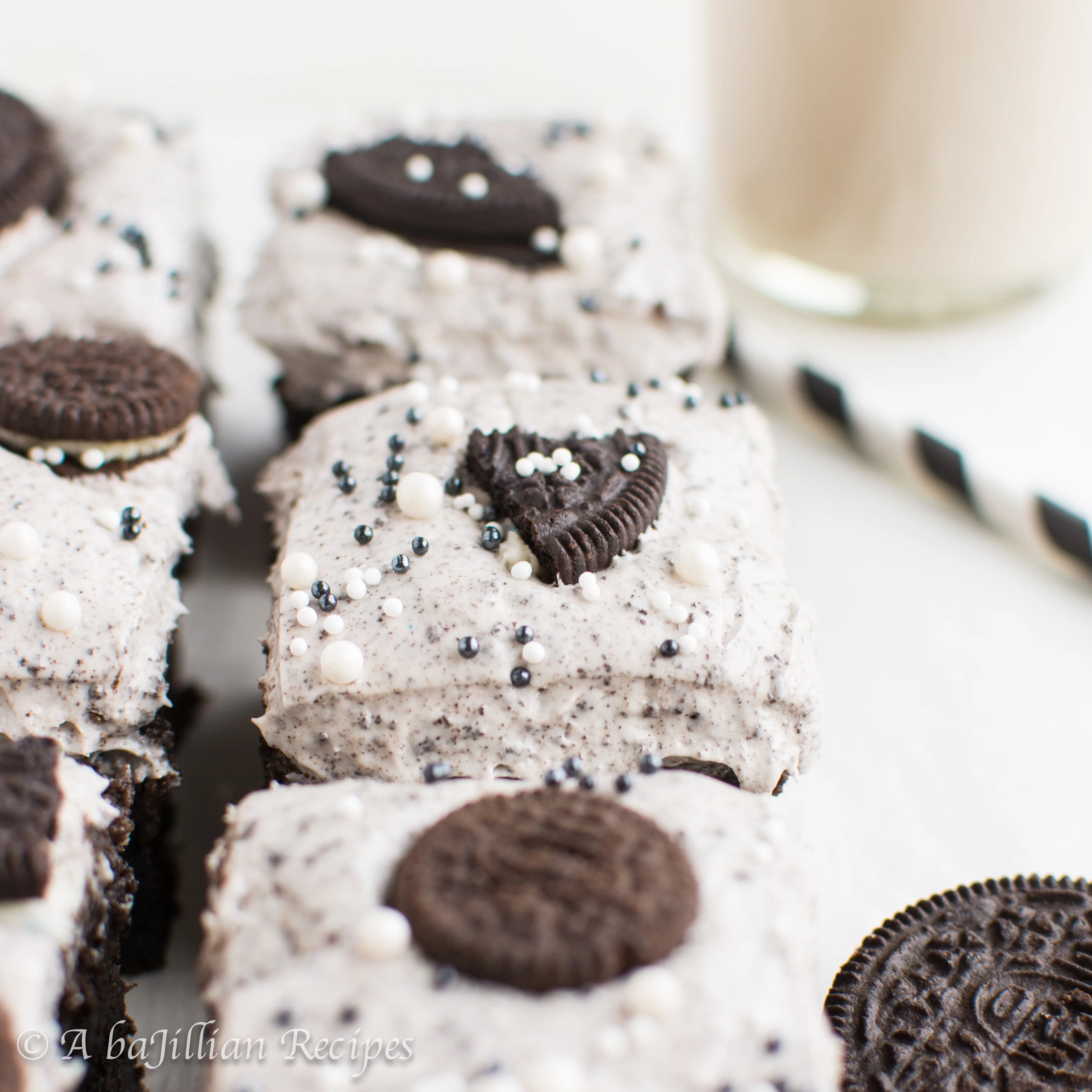 Thick and fudgy brownies, Oreo truffle filling, and fluffy Oreo frosting! THREE layers of Oreo deliciousness in one bite!