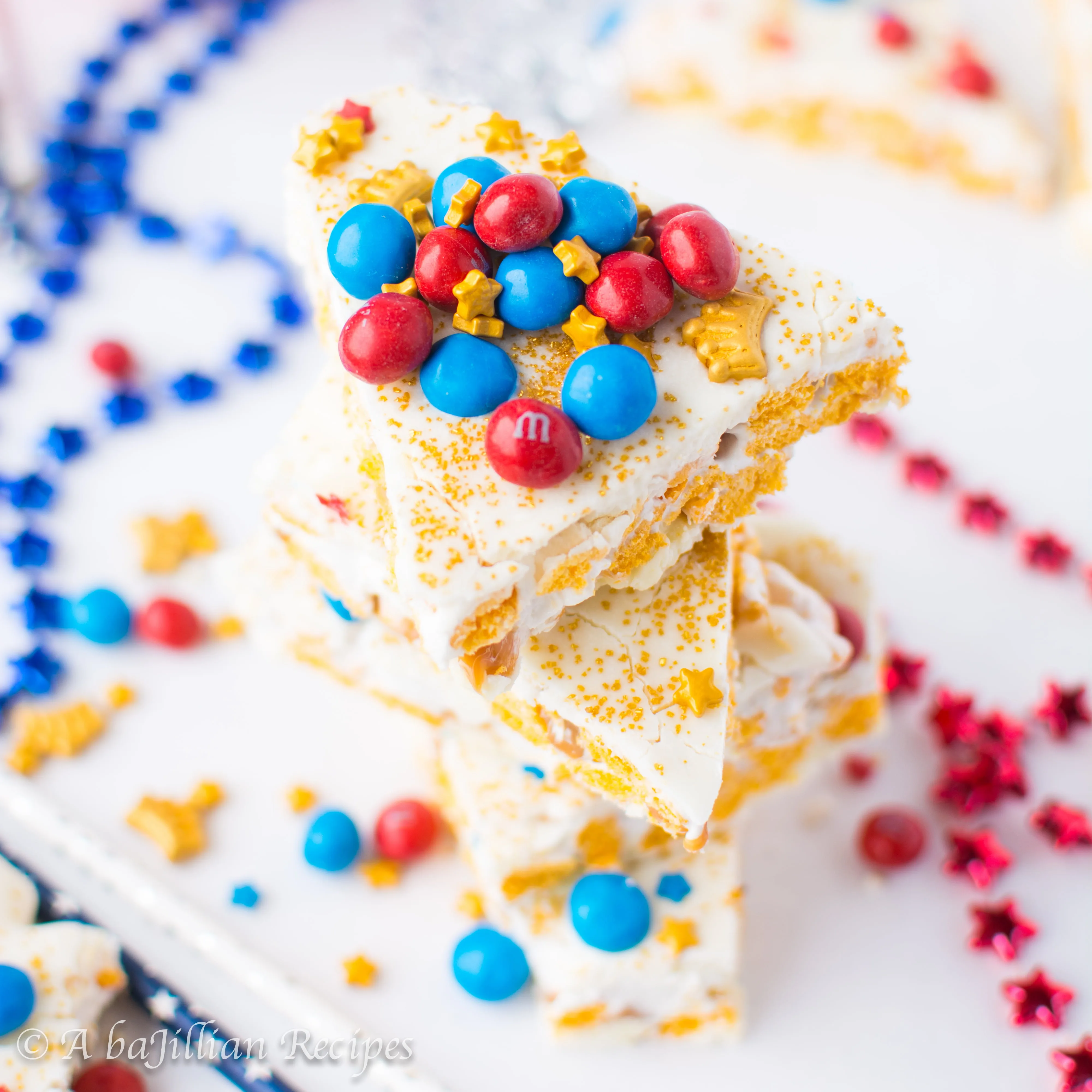This white chocolatey Wonder Woman Caramel Crunch Bark is filled with marshmallowy Cap'n Crunch krispies and golden pockets of ooey gooey caramel!