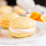 Sweet and citrusy swirled buttercream sandwiched between two light and fluffy cake-like cookies!