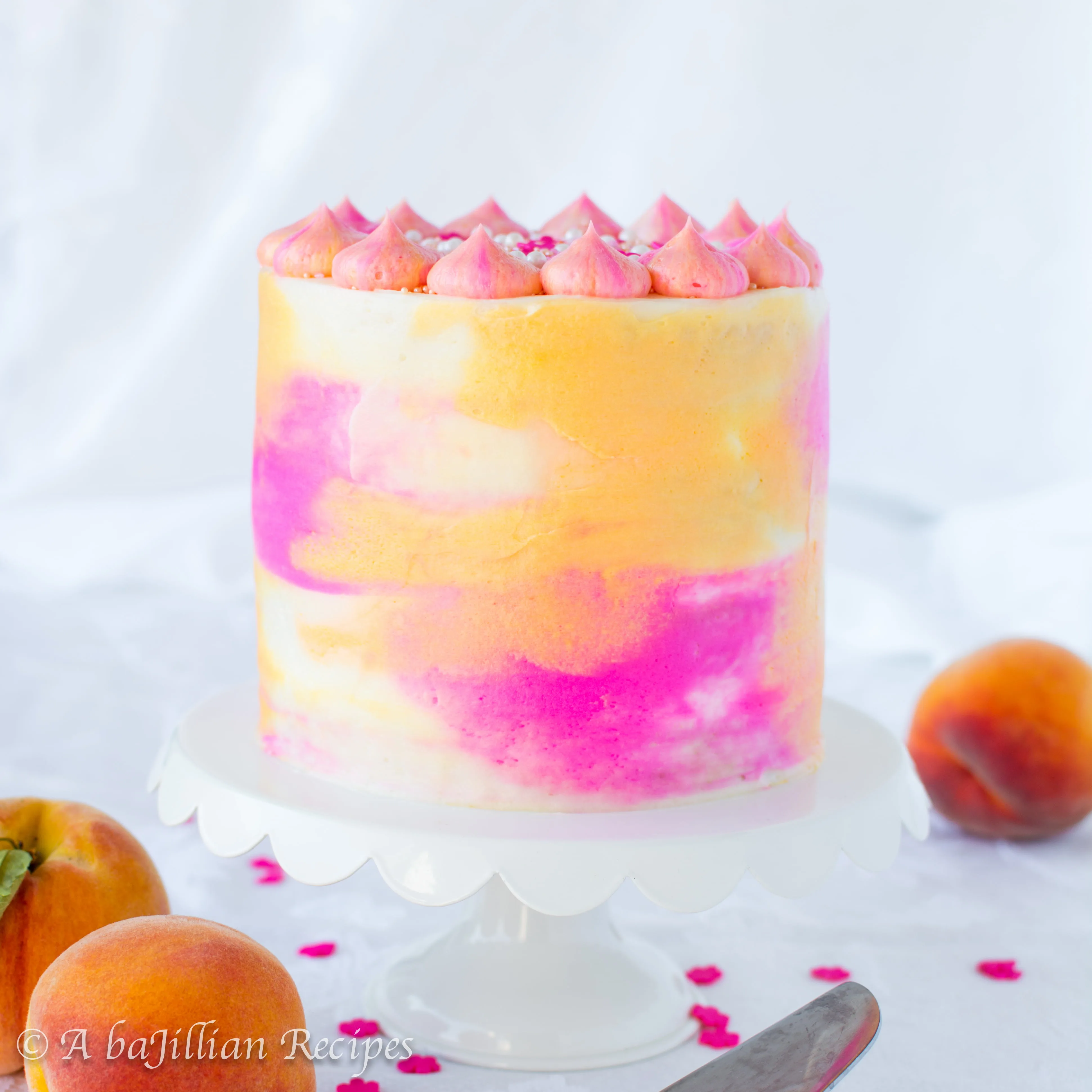 Layers of fluffy cake and fresh peach mousse, artistically frosted in silky smooth buttercream!