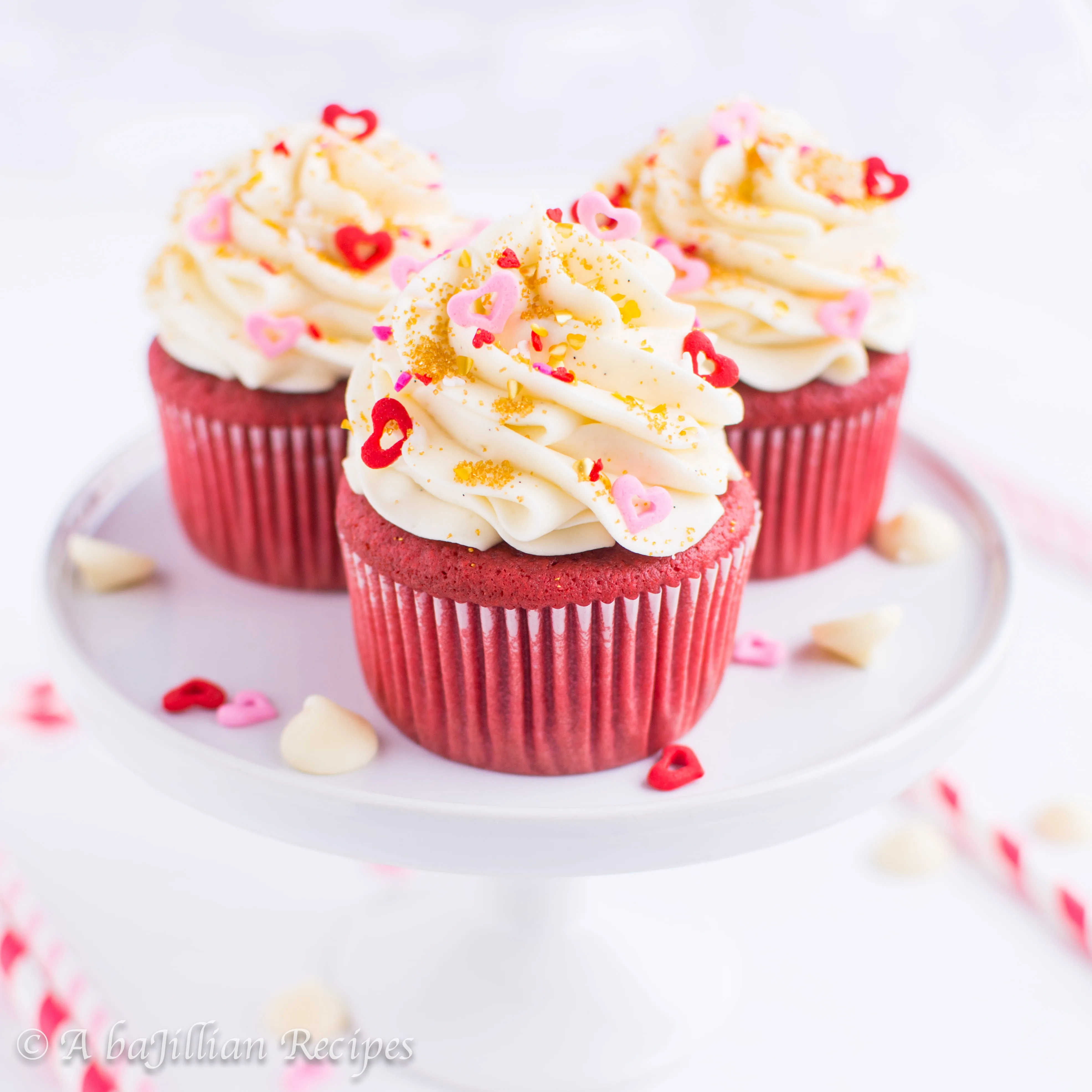 Moist and oh-so-fluffy red velvet cupcakes topped with a whipped, lusciously tangy white chocolate cream cheese frosting!