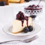 Dense, creamy, and lusciously rich New York-Style Cheesecake crowned with a sweet blackberry topping!