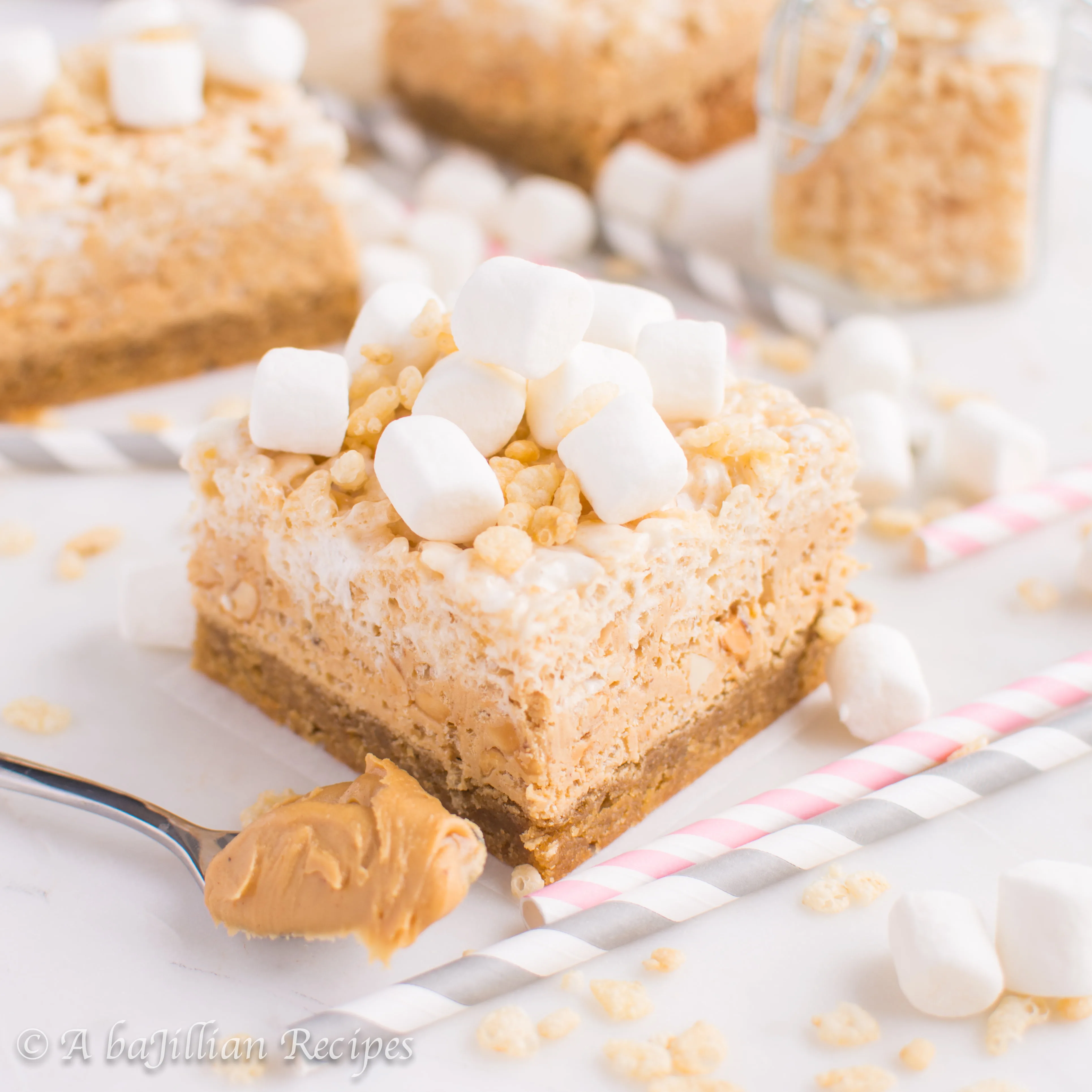 A soft and chewy layer of peanut butter blondies, a layer of white chocolate peanut butter krispies, and a marshmallowy layer of rice krispy treats!