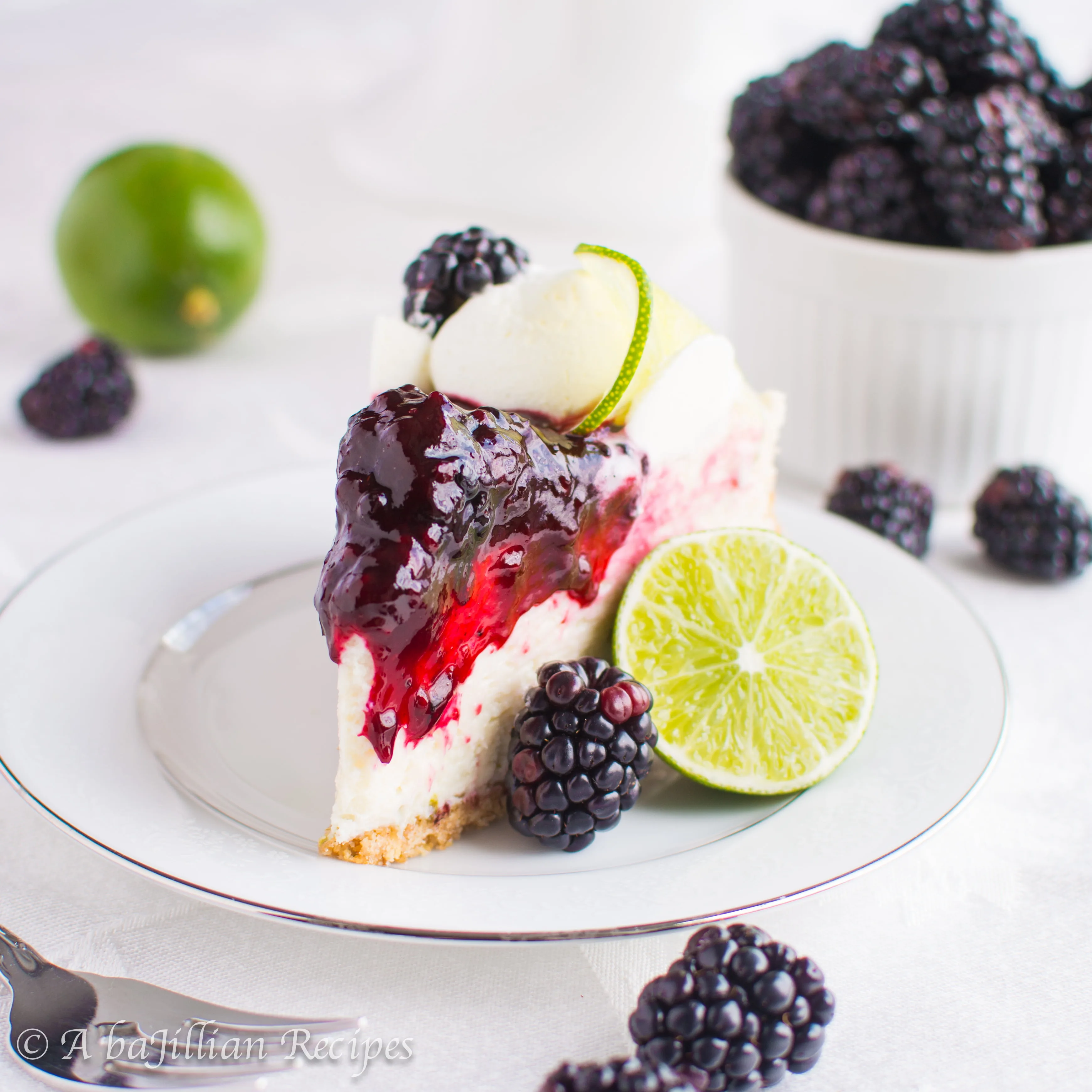 A smooth, creamy, tart key lime filling nestled in a toasted graham cracker crust, and topped with the best blackberry topping!