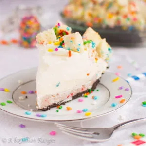 Rainbow Chip mousse, cake truffle filling, and colorful cubes of Funfetti cake all in a chocolatey Oreo cookie crust!