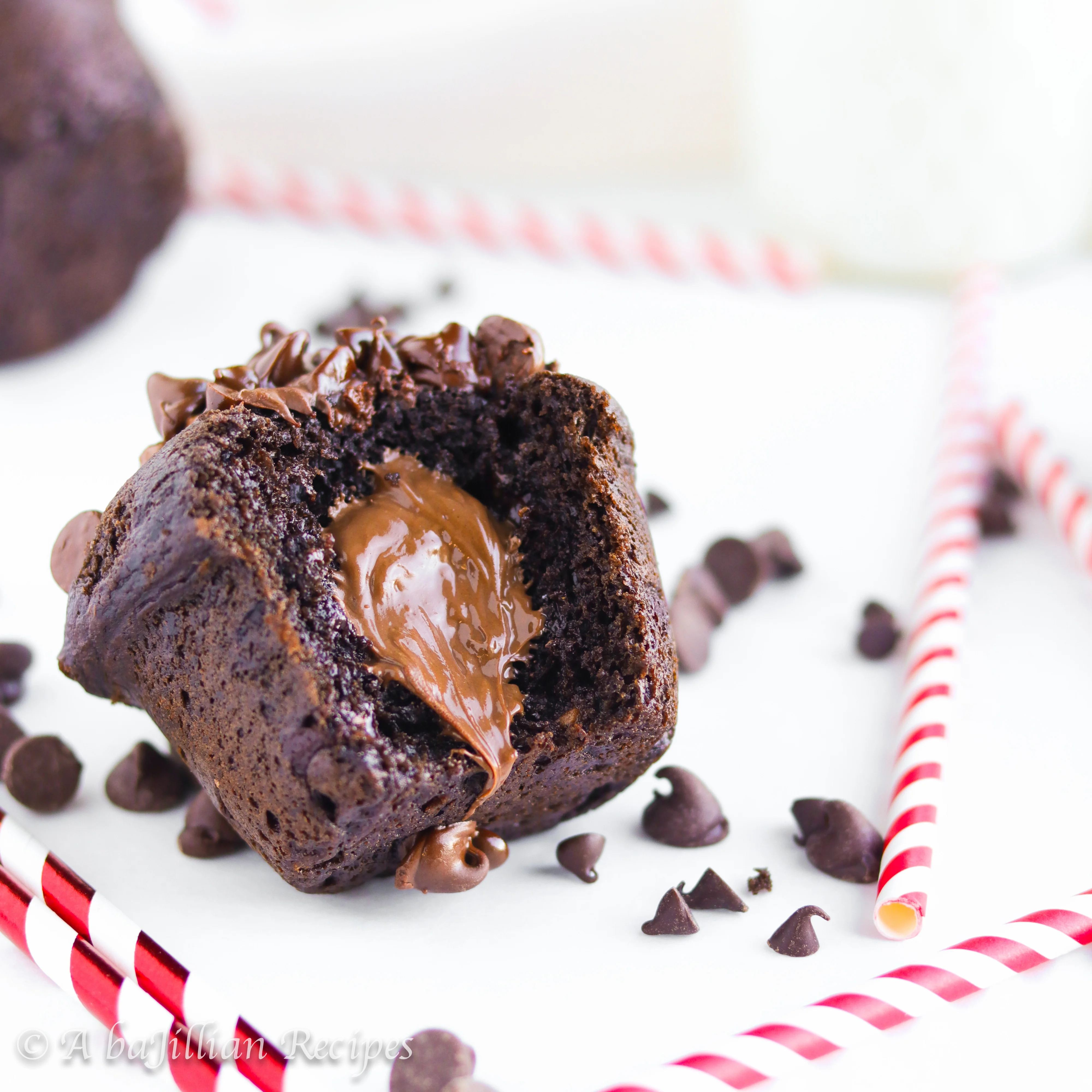 These fluffy chocolate muffins are LOADED with dark chocolate chips, milk chocolate chips, and filled with Nutella!