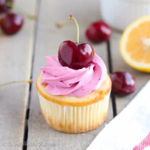 Fluffy lemon cupcakes topped with a sweet swirl of fresh cherry buttercream!