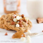 Soft and chewy oatmeal cookies infused with the brown sugary sweetness of cookie butter and loaded with cinnamon and white chocolate chips!