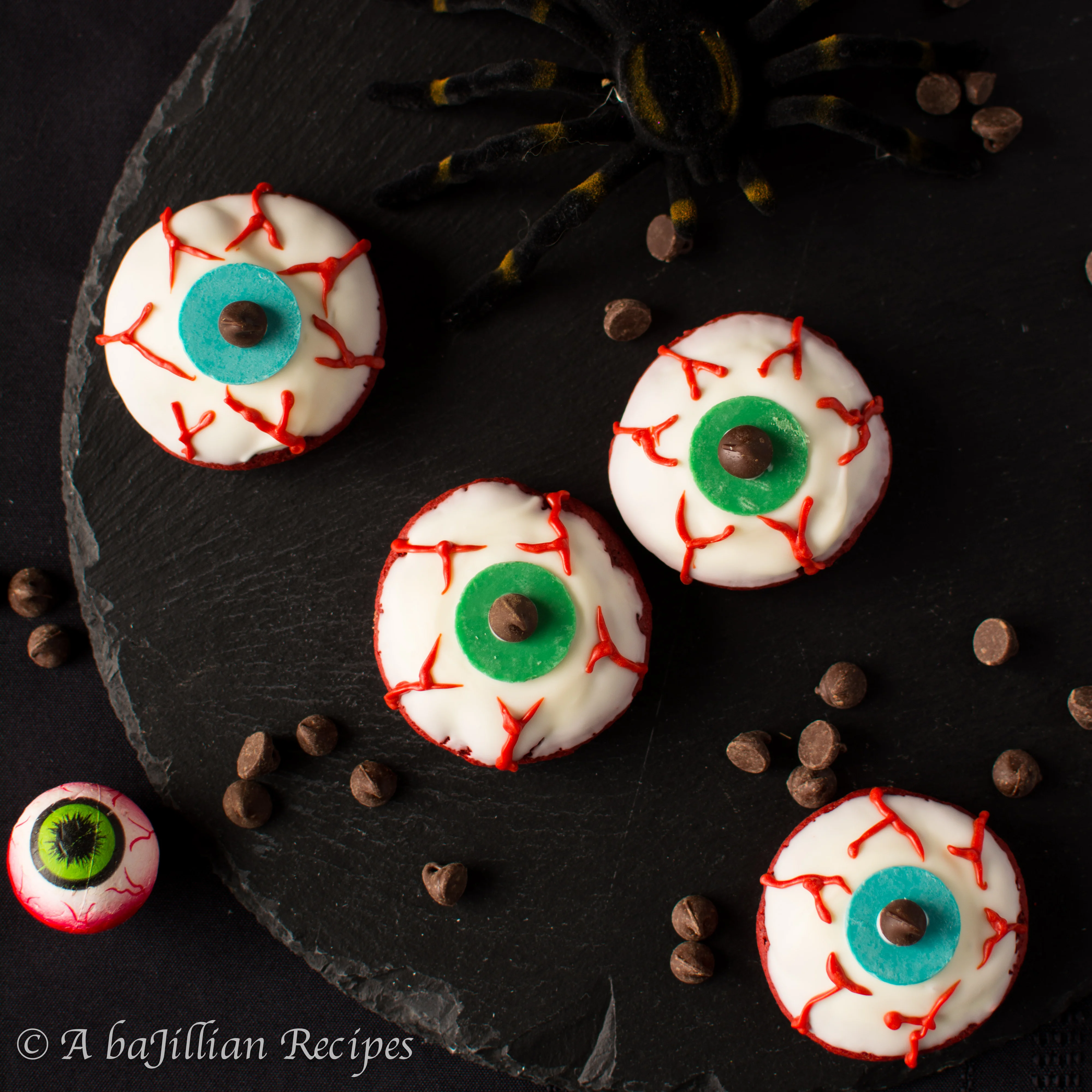 Soft, cake-like red velvet cookies dipped in rich white chocolate and decorated to look like scary cool eyeballs!