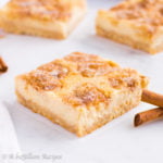 Soft, cinnamon-sugary snickerdoodles and deliciously creamy cheesecake collide in these heavenly bars!