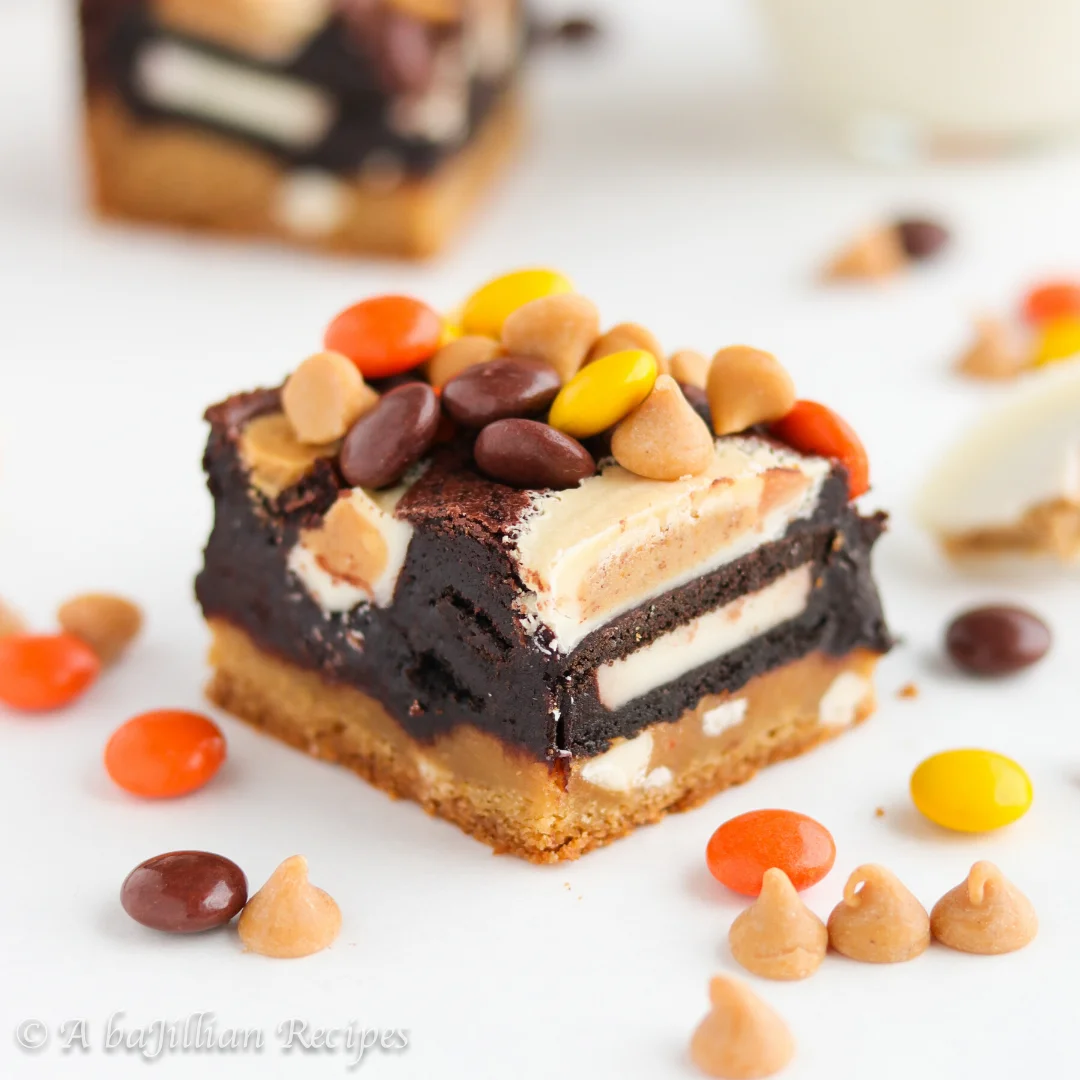 These Triple Decker Brownies have it all--a soft and chewy butterscotch cookie layer, double-stuffed Oreos, fudgy brownies, and a medley of Reese's candies! 