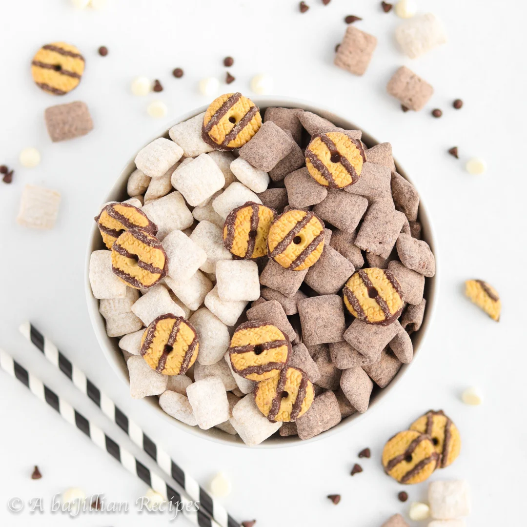An addictive mix of white chocolate cake mix-coated cereal squares, chocolate cake mix-coated cereal squares, and fudge stripe cookies!