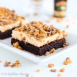 Rich and fudgy brownies topped with a deliciously dreamy Irish Cream buttercream and buttery toffee bits!
