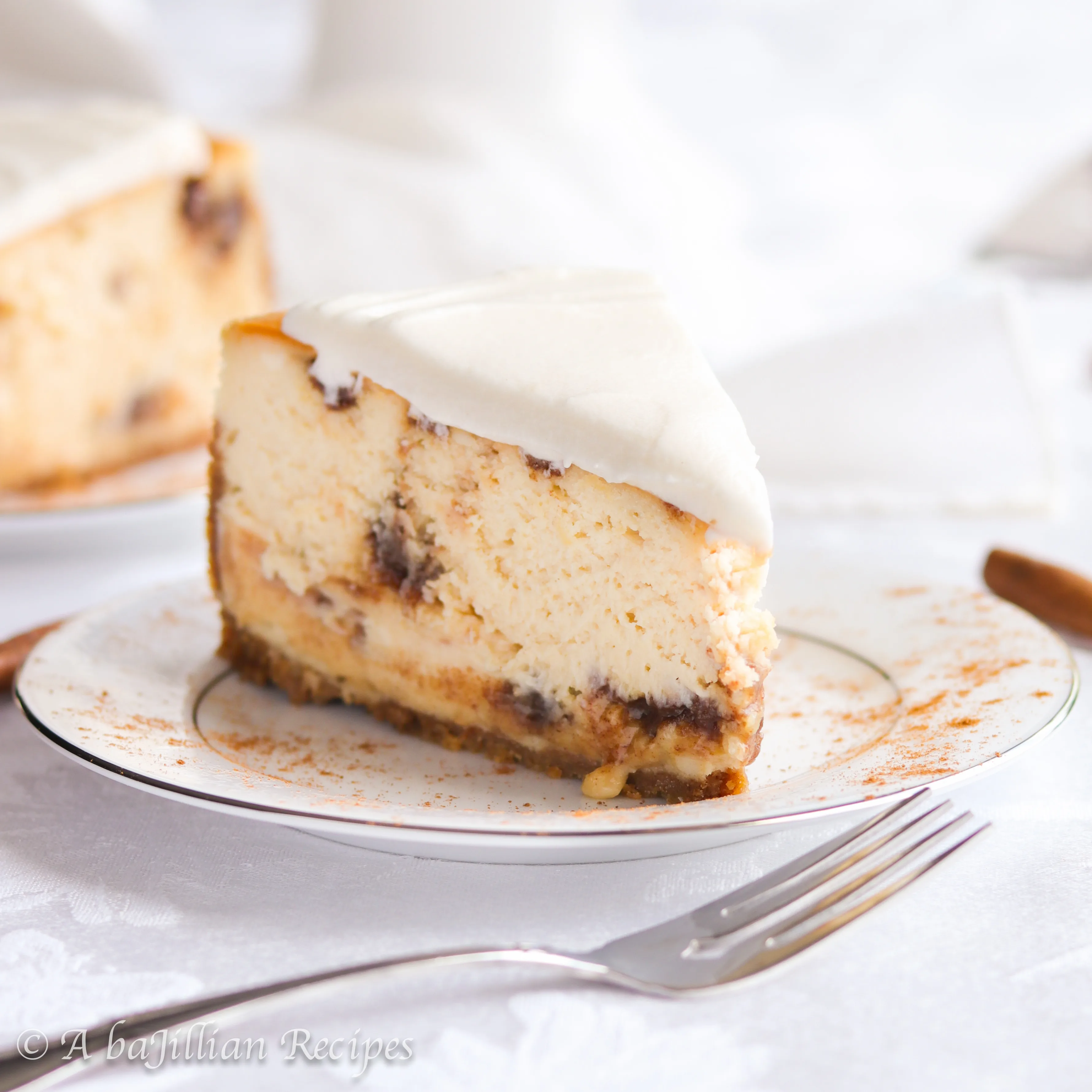 This Cinnamon Roll Cheesecake is rich, creamy, and brimming with buttery pockets of brown sugar-cinnamon filling. It's also topped with the most incredible vanilla icing!