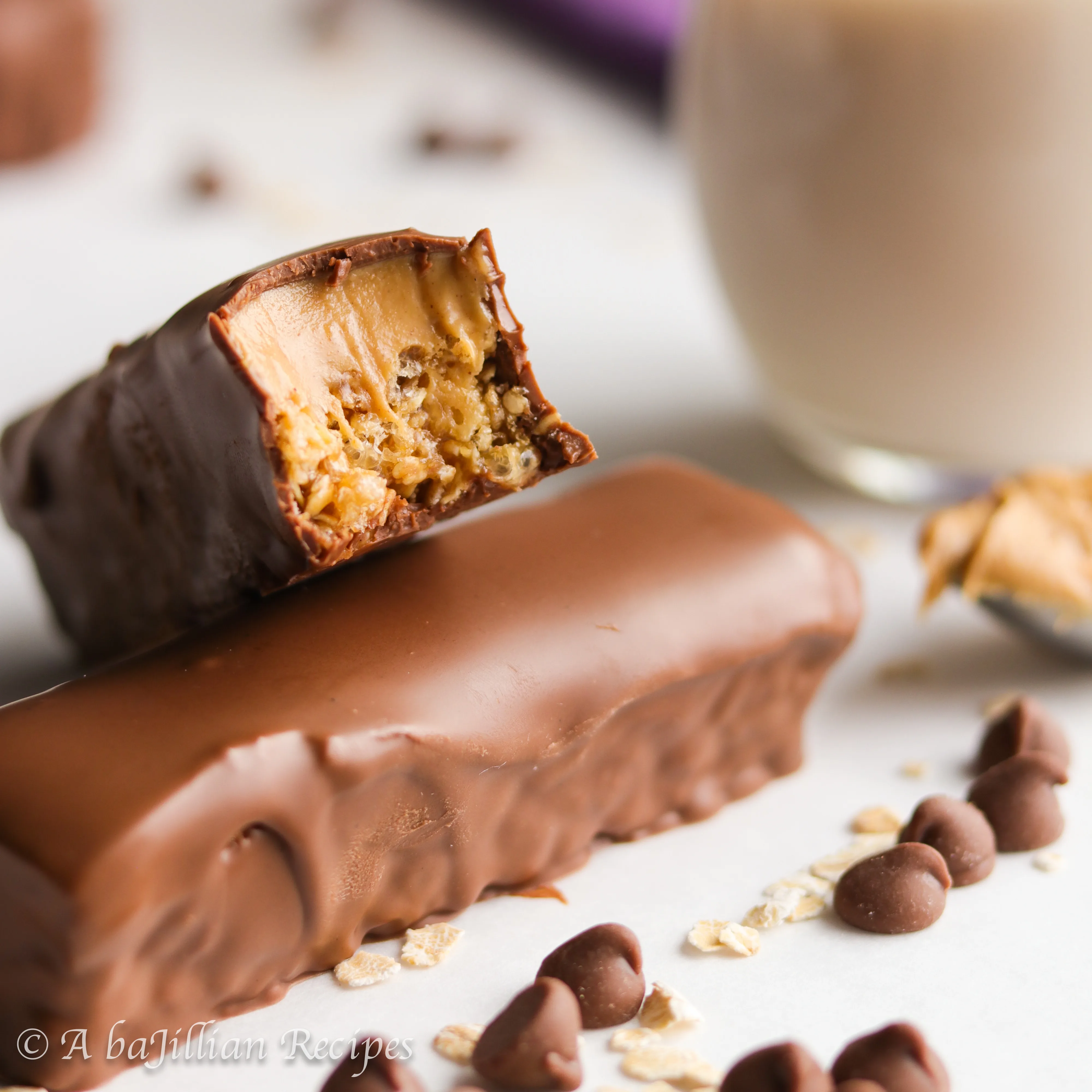 Soft and chewy granola bars topped with a layer of creamy peanut butter and coated in milk chocolate! Relive your childhood with this 90's kid classic!