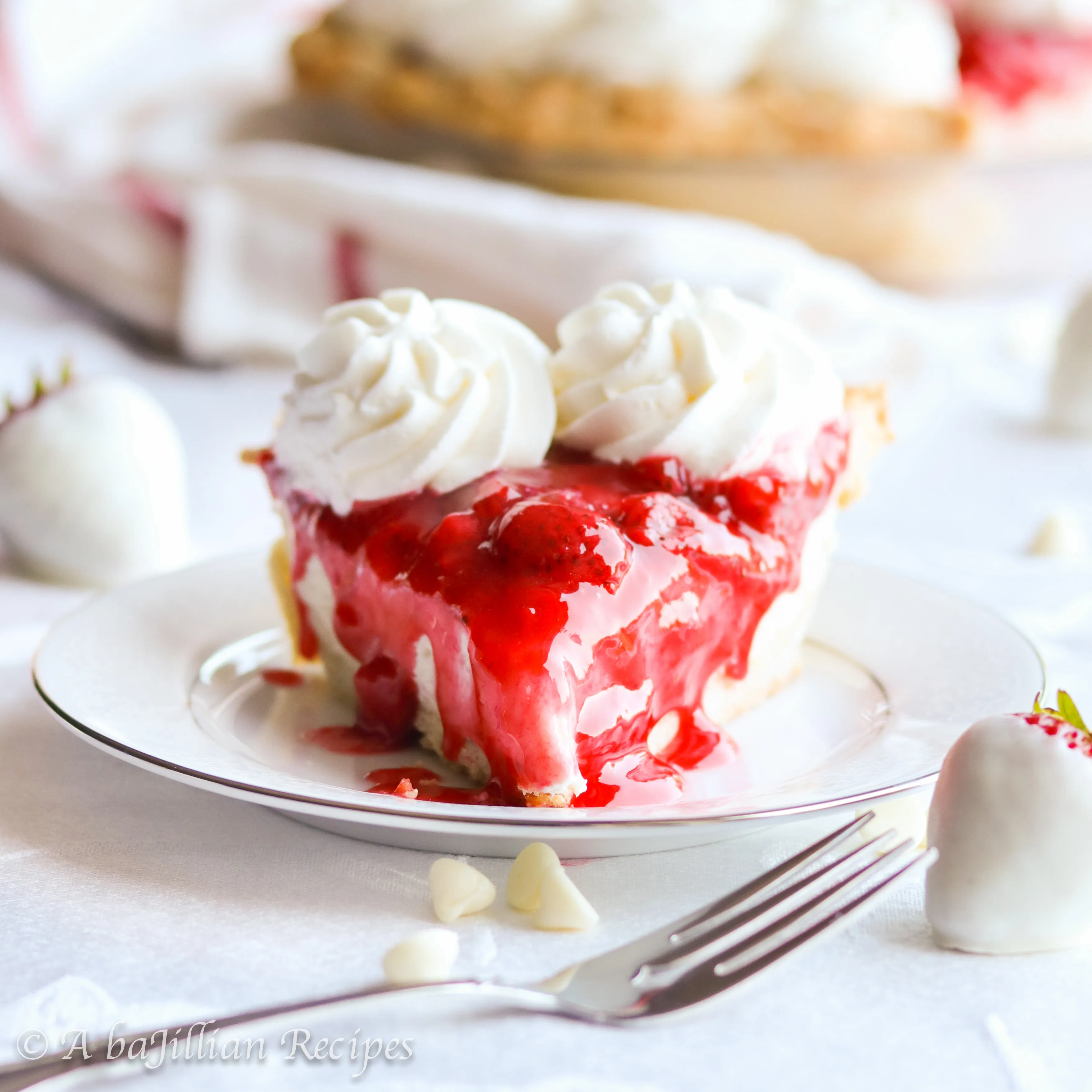 Dreamy, creamy white chocolate cream filling in a golden flakey crust, topped with a sweet homemade strawberry sauce!