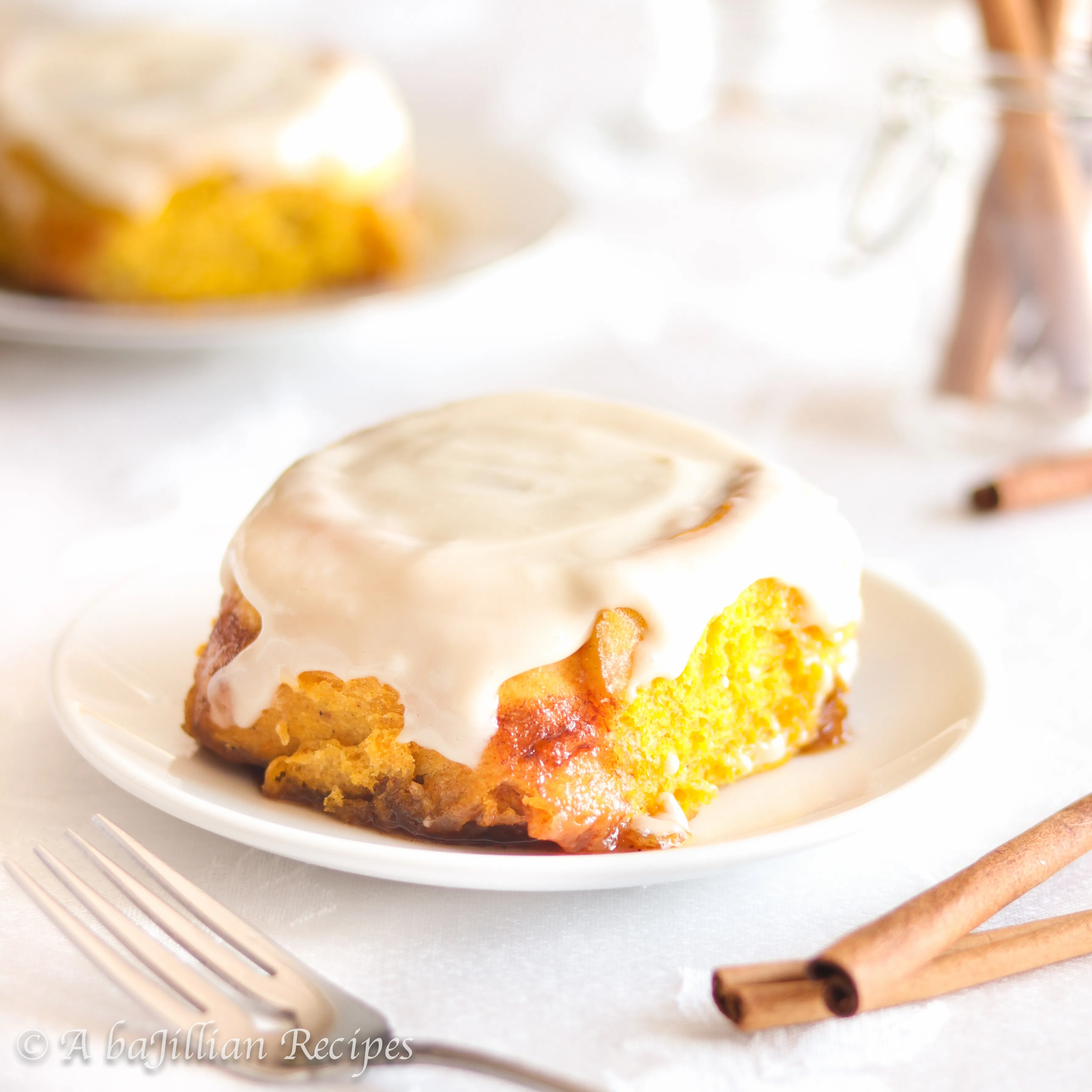 Soft and incredibly doughy pumpkin cinnamon rolls topped with rich and velvety maple cream cheese icing!