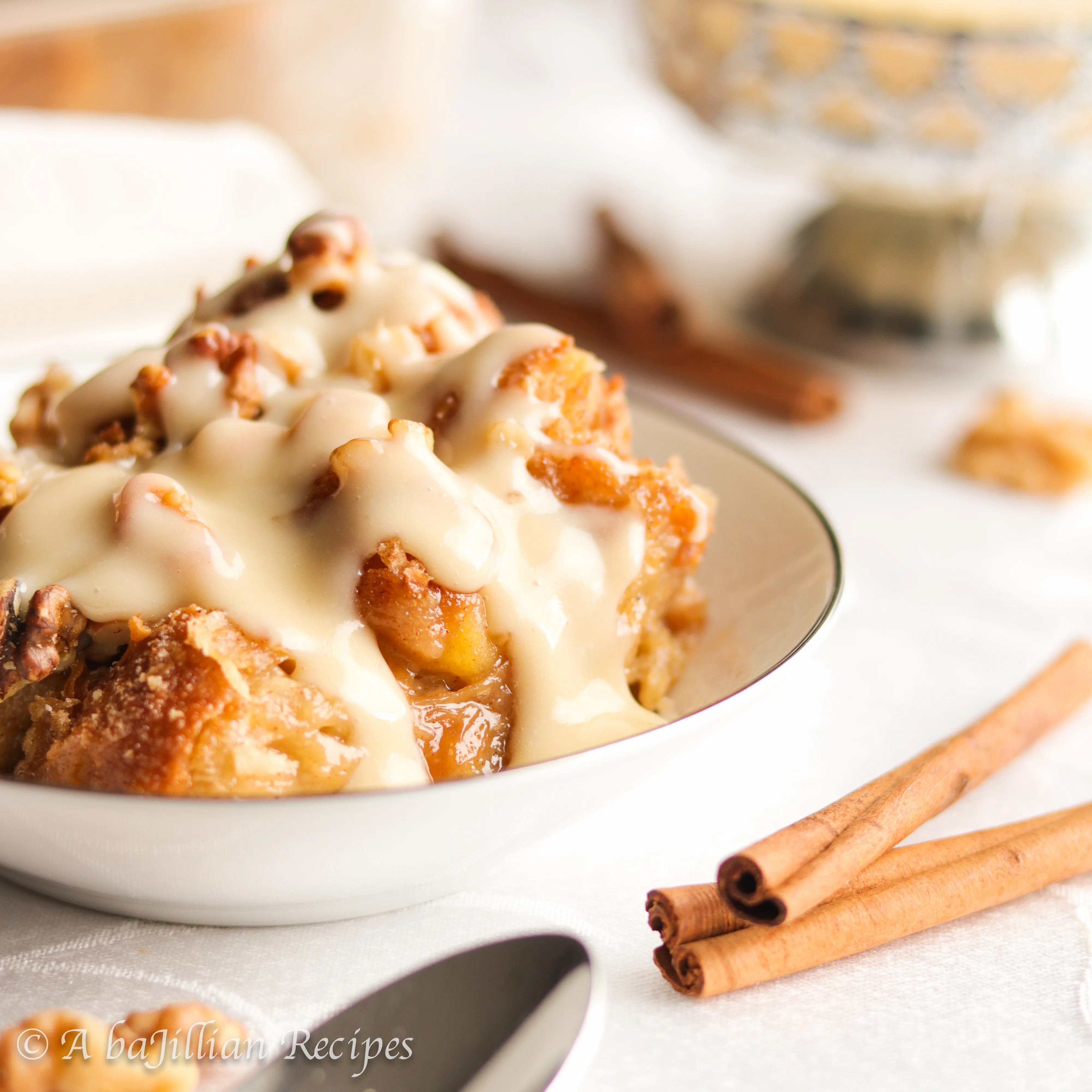 Warm and  comforting, this Apple Pie Bread Pudding is made with soft and flaky croissants, cinnamon-spiced apples, and drizzled in the most delicious vanilla sauce!
