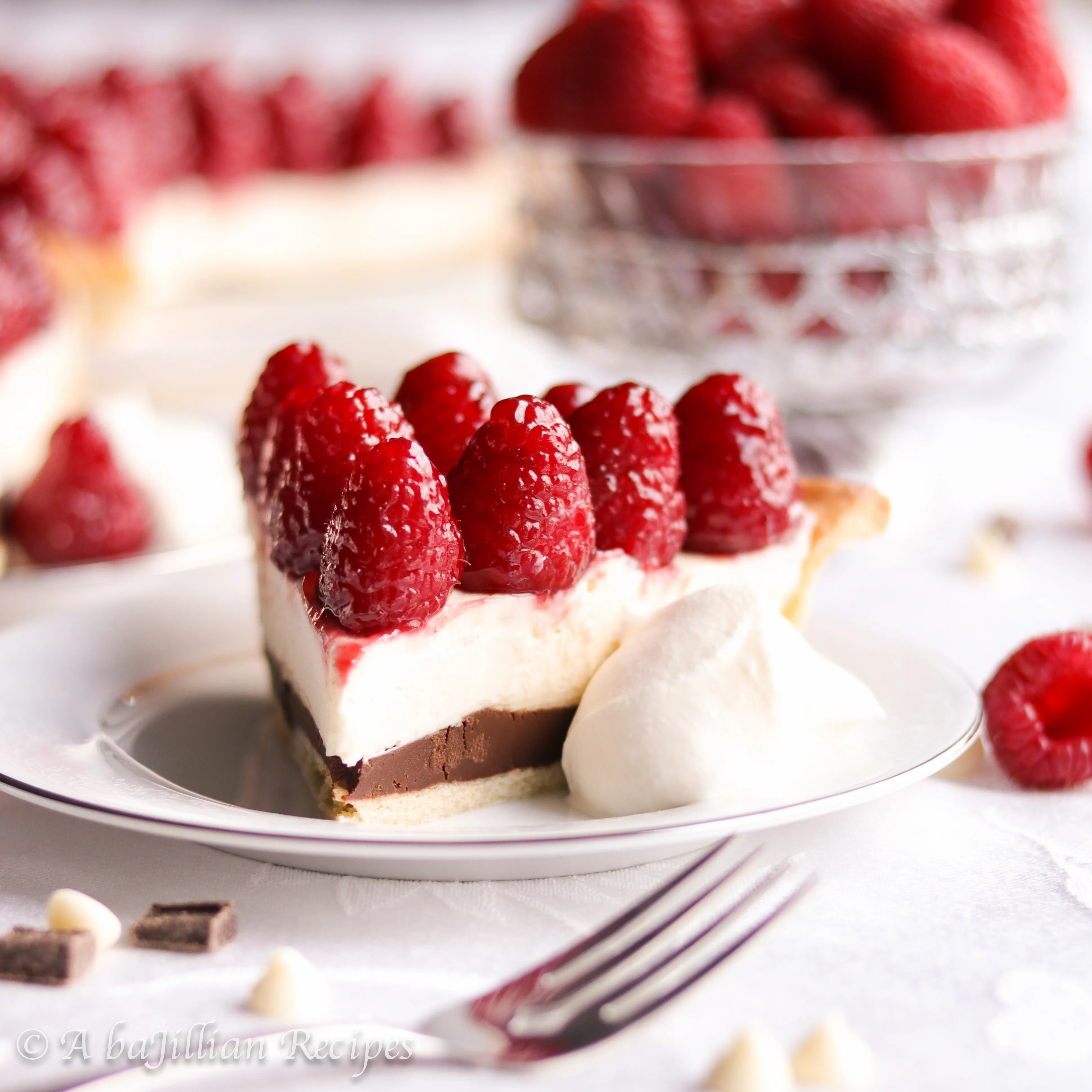 Rich chocolate ganache, heavenly white chocolate cream filling, and beautifully glazed raspberries all in a buttery flaky crust!