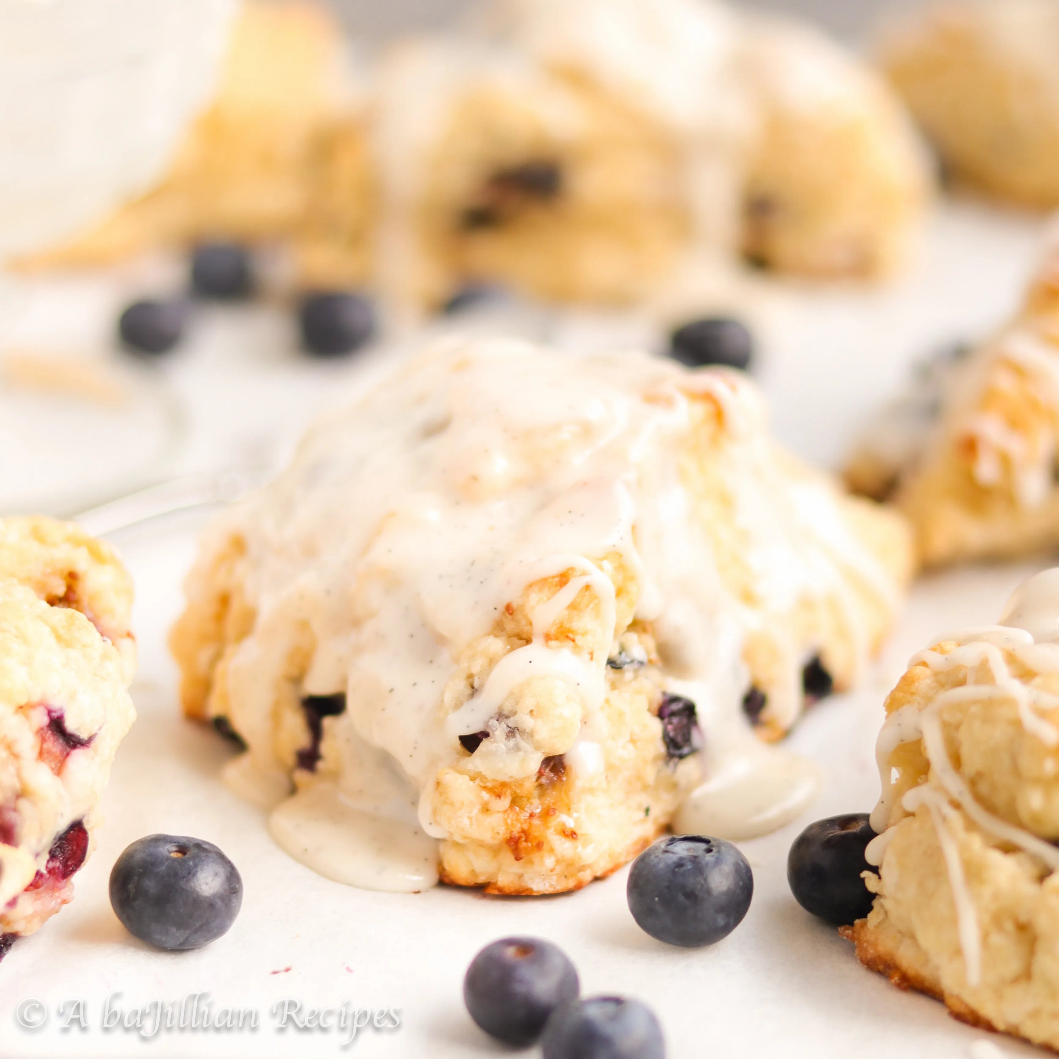 These homemade scones are soft, tender, loaded with juicy blueberries, and drizzled with the most heavenly vanilla bean icing!