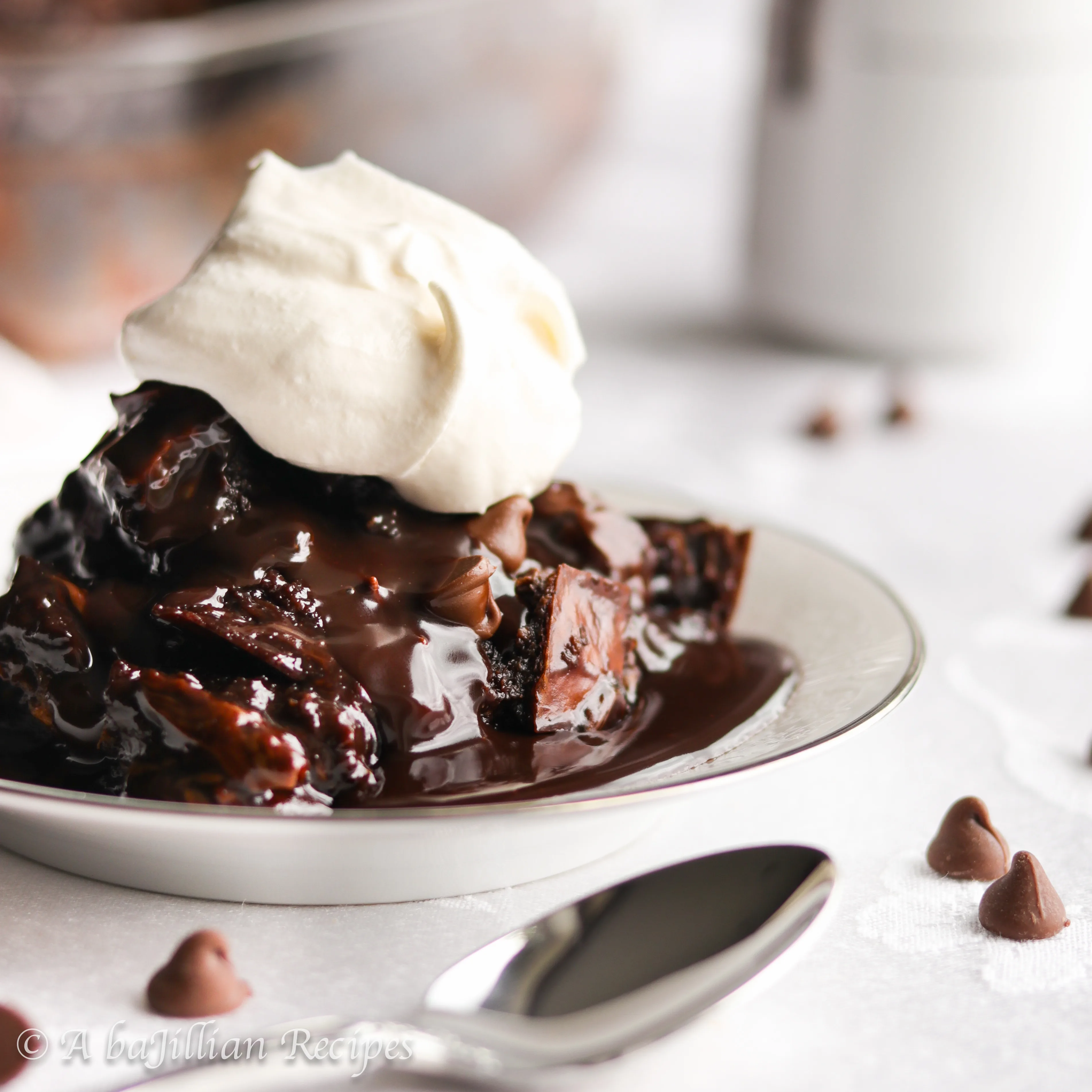 This Death By Chocolate Bread Pudding is made with fluffy cubes of challah bread, rich chocolate custard, and a generous drizzle of Nutella ganache! Decadent would be an understatement.