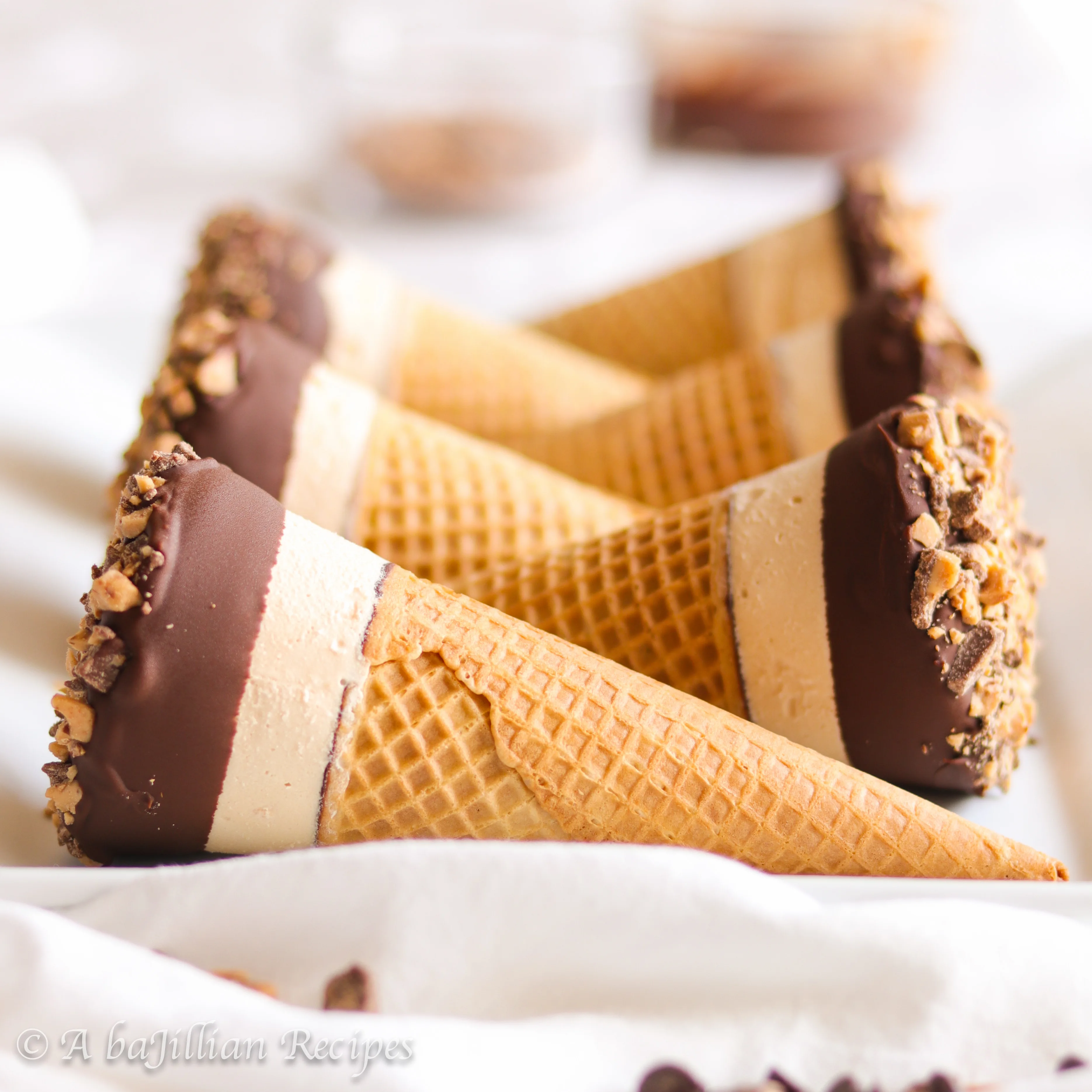 Ultra creamy no-churn salted caramel ice cream in a crispy chocolate-coated sugar cone, dunked in dark chocolate and buttery toffee bits!