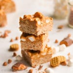 Ooey gooey Butterfinger rice krispies treats topped with a peanut buttery butterscotch layer loaded with peanuts, marshmallows, and Nutter Butter cookies!