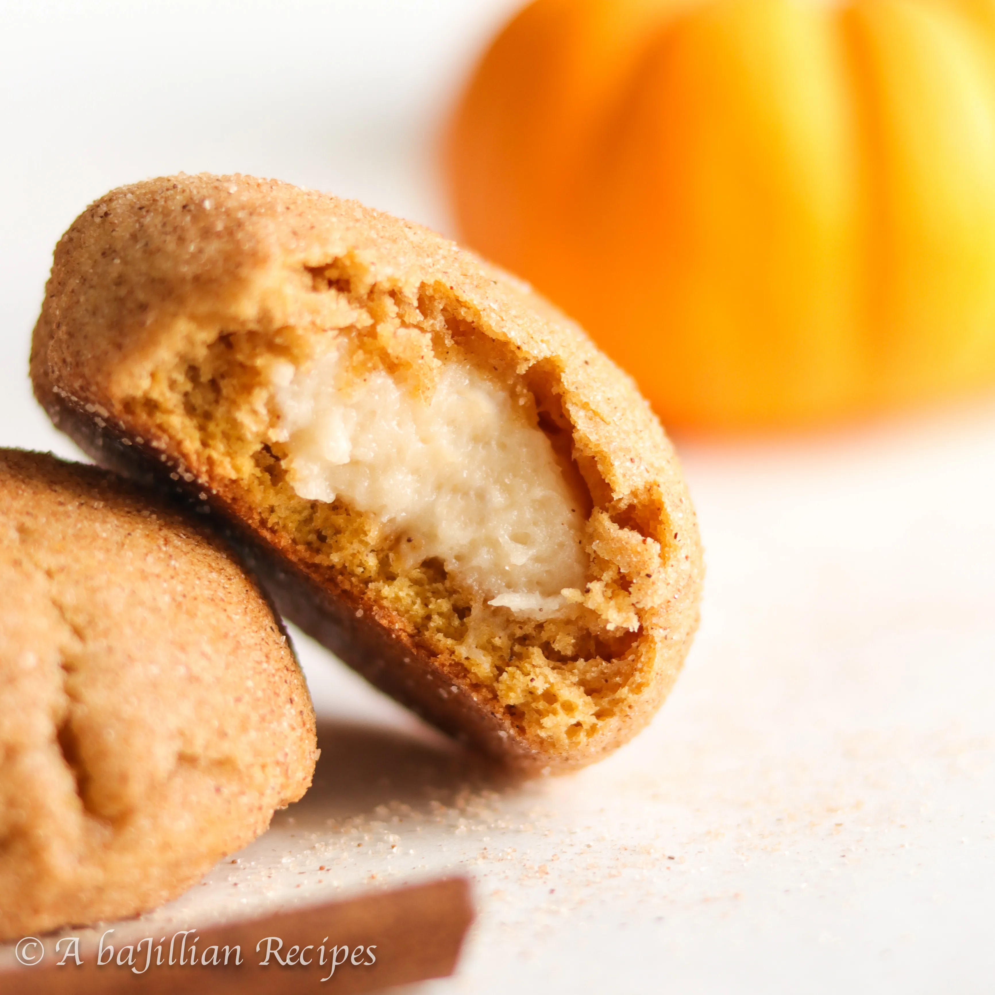 Soft and chewy pumpkin snickerdoodles stuffed with creamy cheesecake filling!