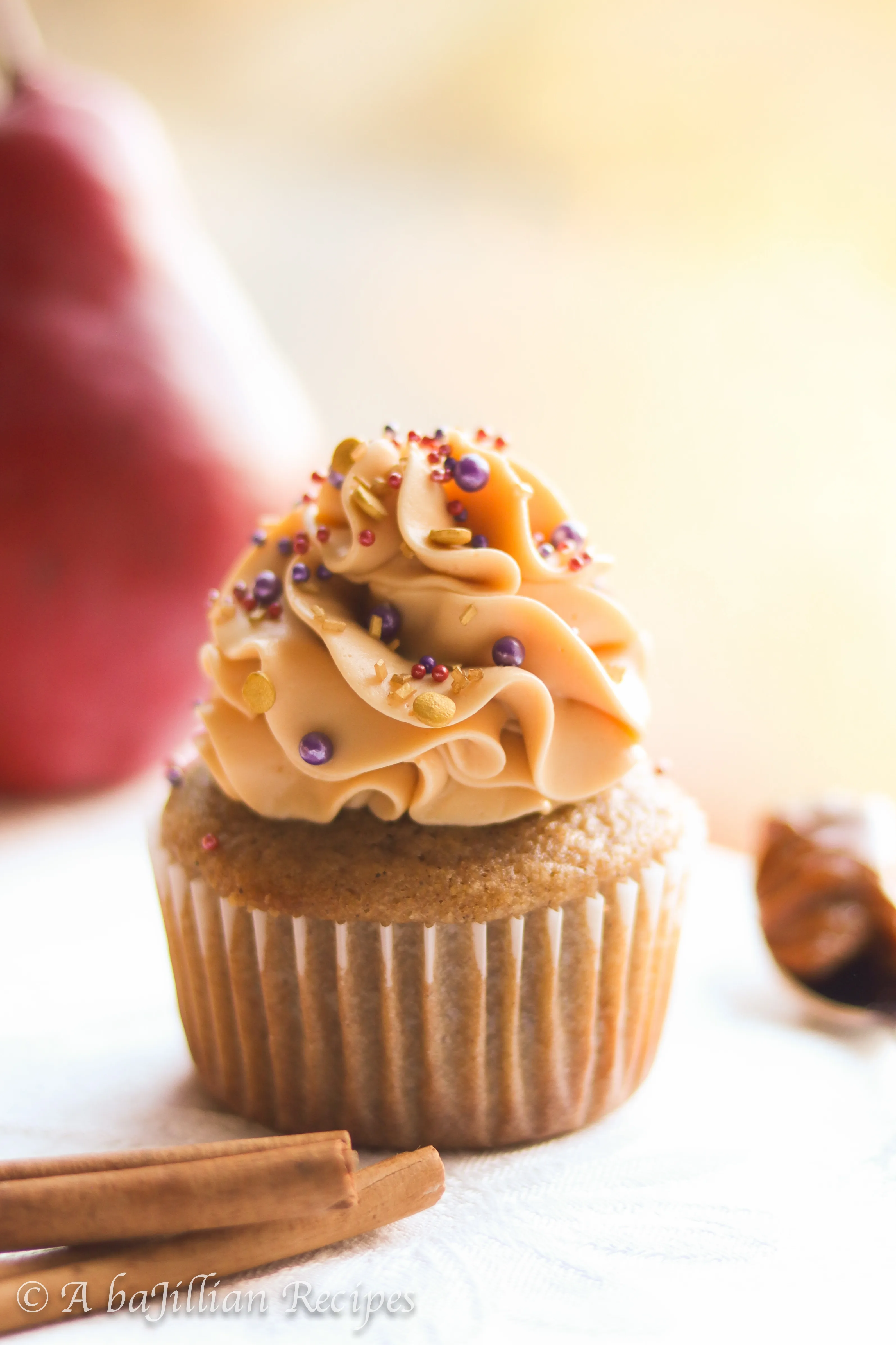Deliciously moist and fluffy pear cupcakes filled with rich dulce de leche and topped with a silky crown of dulce de leche swiss meringue buttercream!