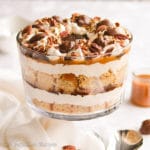 Fluffy cubes of butter pecan cake between layers of creamy caramel mousse, chocolate ganache, salted caramel, and toasted pecans!