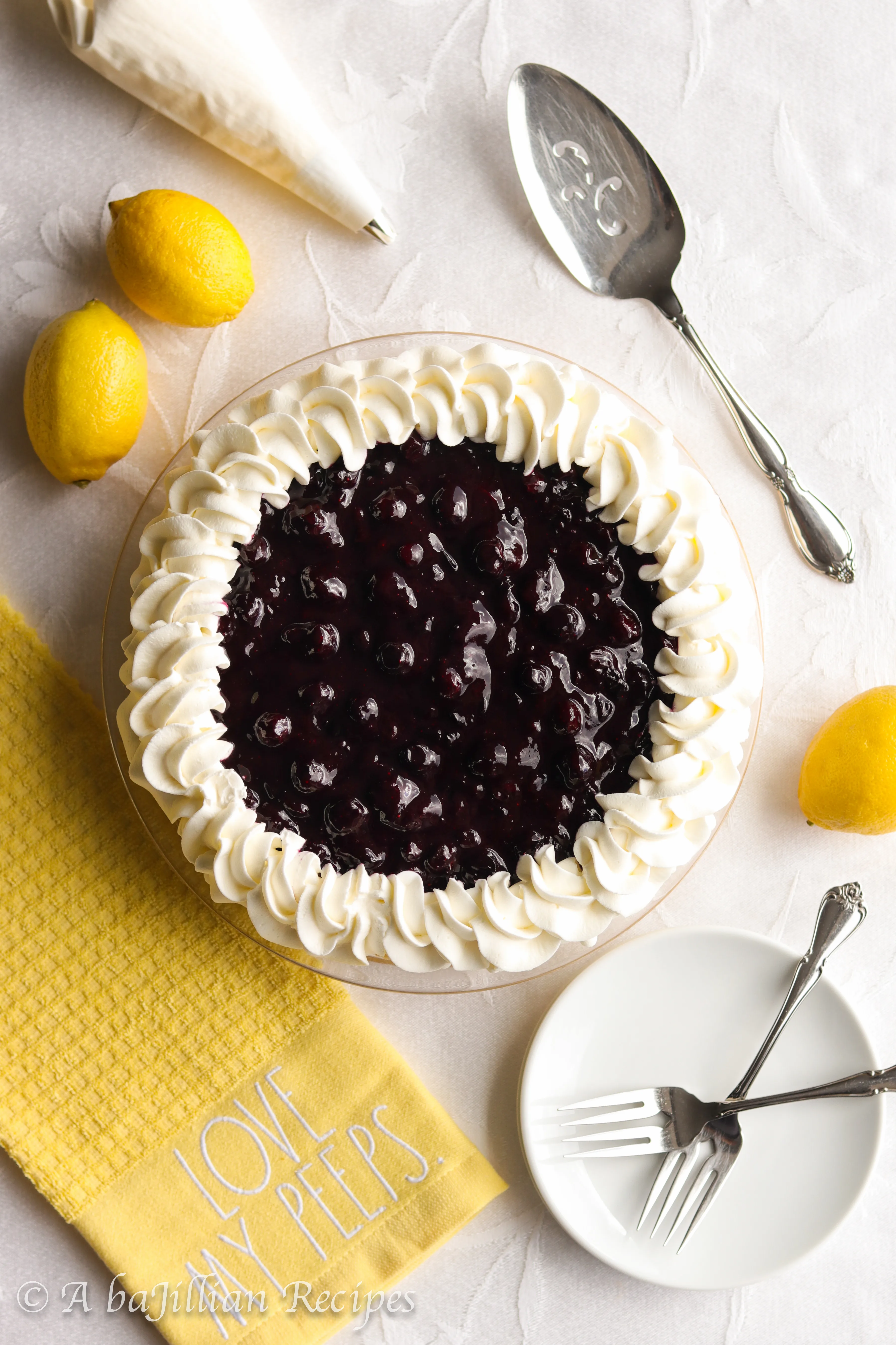 A buttery shortbread cookie crust filled with unbelievably creamy lemon mousse-like filling and topped with a sweet homemade blueberry topping!