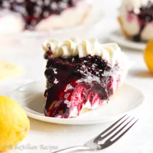 A buttery shortbread cookie crust filled with unbelievably creamy lemon mousse-like filling and topped with a sweet homemade blueberry topping!