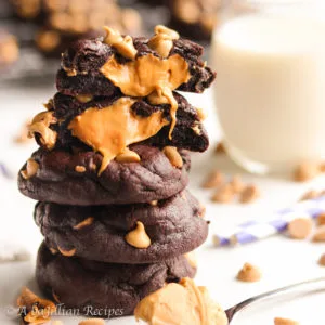 Soft and chewy dark chocolatey cookies loaded with peanut butter chips and a mouthwatering peanut butter butterscotch center!