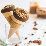 Incredibly creamy caramel ice cream in a crispy chocolate-coated sugar cone, dipped in dark chocolate and toasted pecans! Don't forget the surprise dulce de leche center!