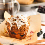 Moist and incredibly fluffy muffins that are brimming with blackberries, swirled with cinnamon sugar, topped with brown sugary streusel, and drizzled in silky sweet vanilla icing!