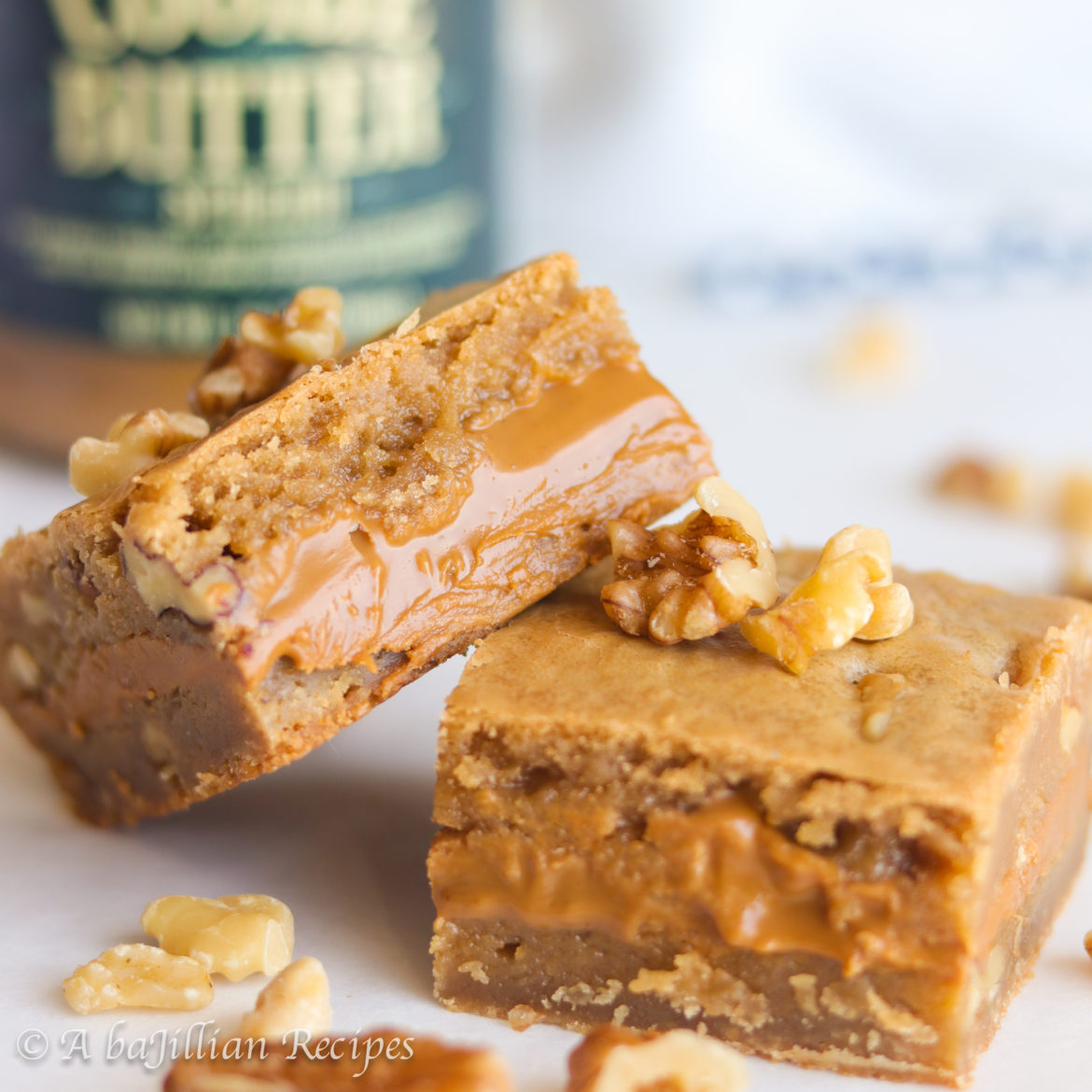 Soft and chewy brown butter blondies stuffed with a generous layer of creamy cookie butter!