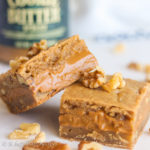 Soft and chewy brown butter blondies stuffed with a generous layer of creamy cookie butter!