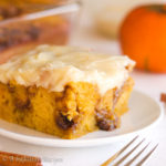 Incredibly moist and fluffy pumpkin cake swirled with pockets of brown sugary cinnamon filling and slathered in a blanket of cream cheese frosting!