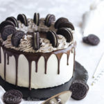 A soft and chewy brownie topped with a layer of homemade Oreo ice cream, frosted in fluffy whipped cream and blanketed in rich chocolate ganache!