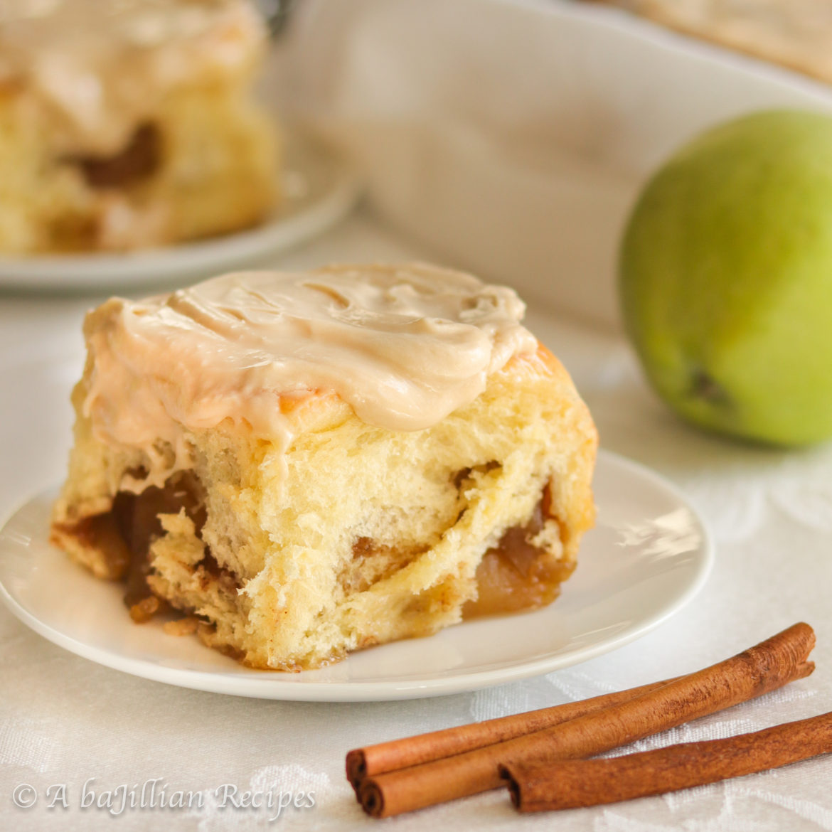 The softest and fluffiest cinnamon rolls swirled with fresh apple filling and slathered in the most exquisite maple cream cheese frosting!