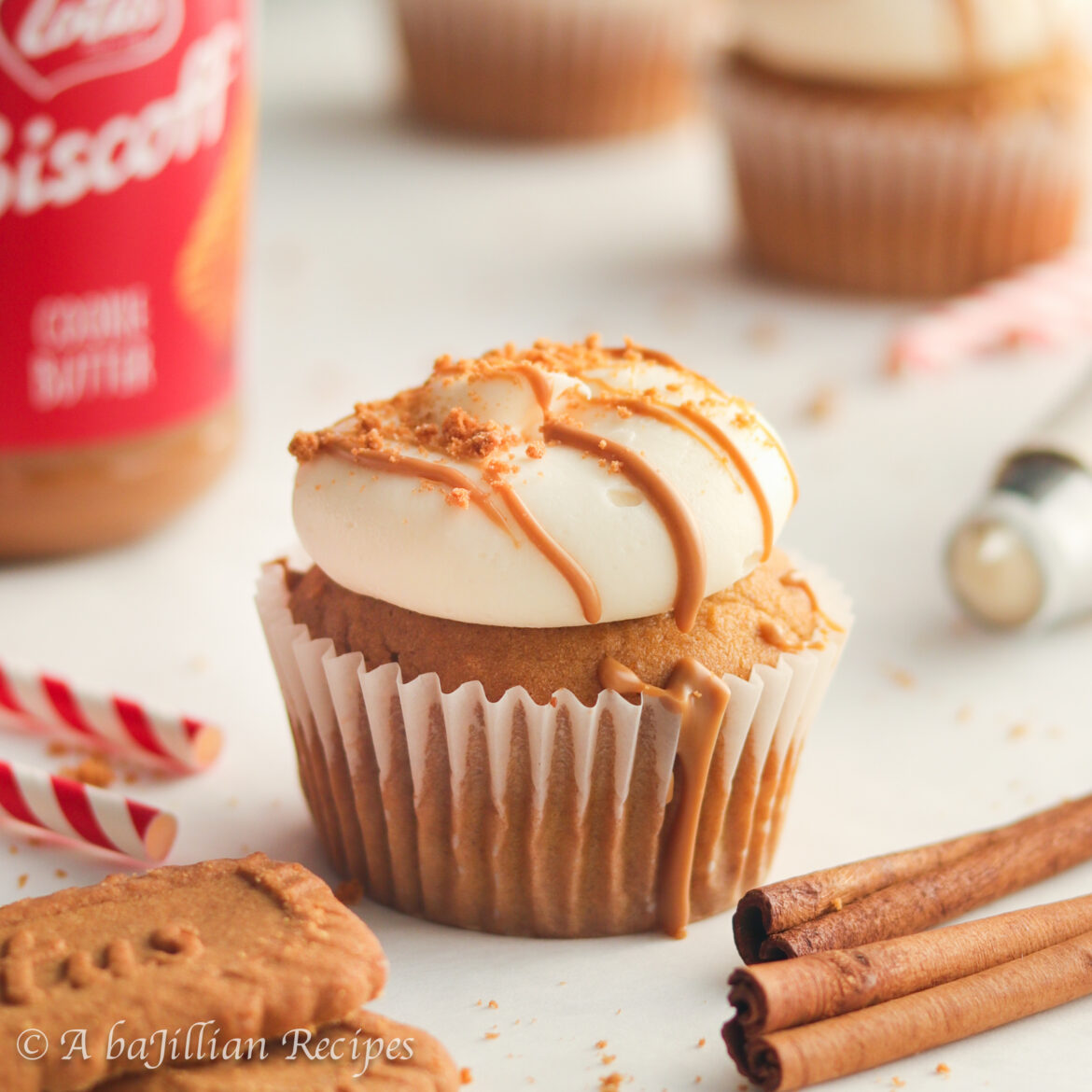 Incredibly moist and fluffy cupcakes brimming with both pumpkin and buttery Biscoff cookie butter, topped with smooth and tangy cream cheese frosting, and drizzled with MORE cookie butter!