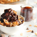This Almond Joy Bread Pudding features buttery soft croissants immersed in a sweet coconut custard, topped with toasted almond-coconut streusel, and drizzled in silky chocolate ganache!