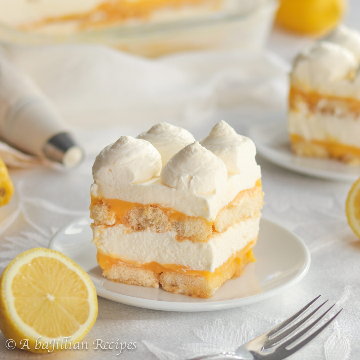 This Lemon Tiramisu contains layers of lemon syrup-soaked ladyfingers, lusciously tangy lemon curd, and fluffy lemon-kissed mascarpone filling!